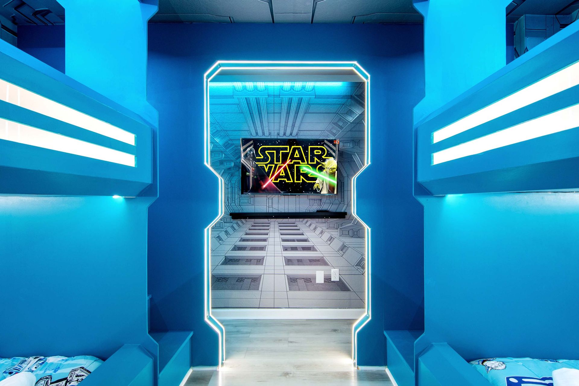 STAR WARS bunk room: futuristic design with neon light and giant TV.