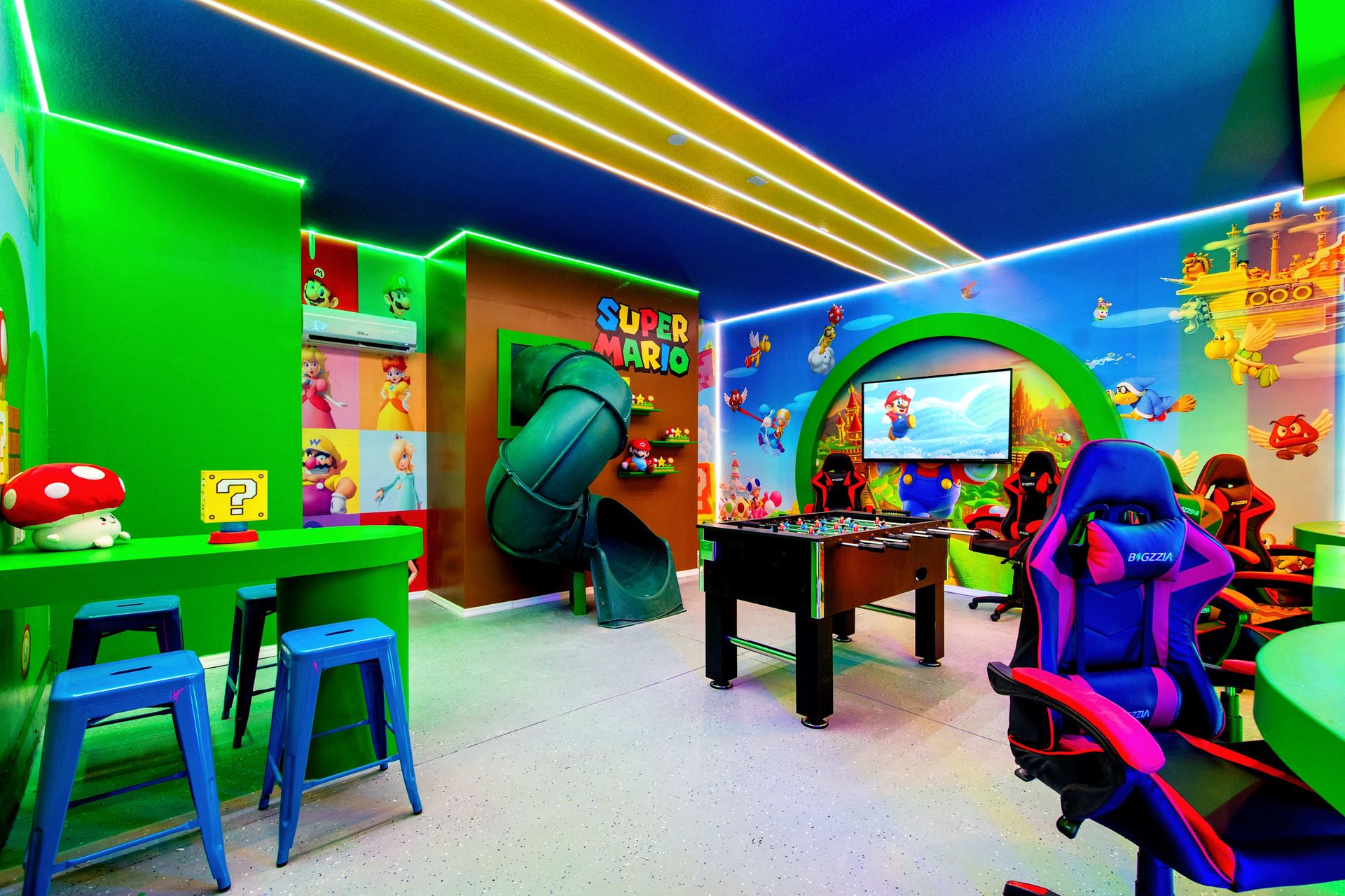 Ultimate Super Mario-themed game room with slide, foosball, and gaming.