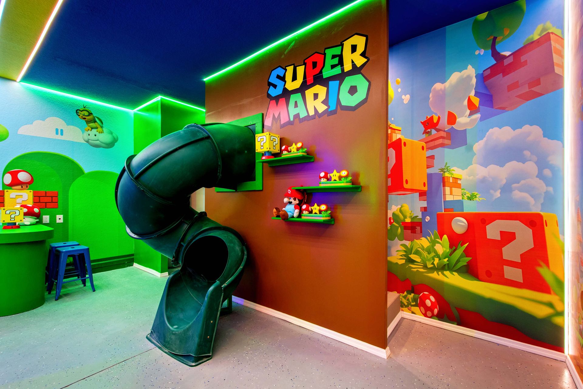 Super Mario fun zone with a giant slide and neon lighting.