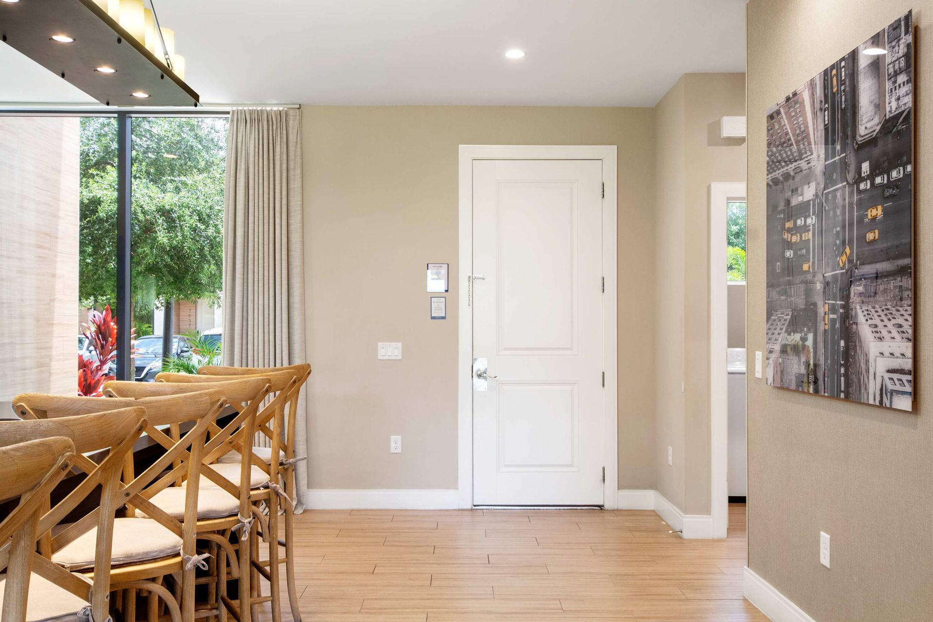 Clean entry, modern art, and stylish bar seating create a welcoming space.