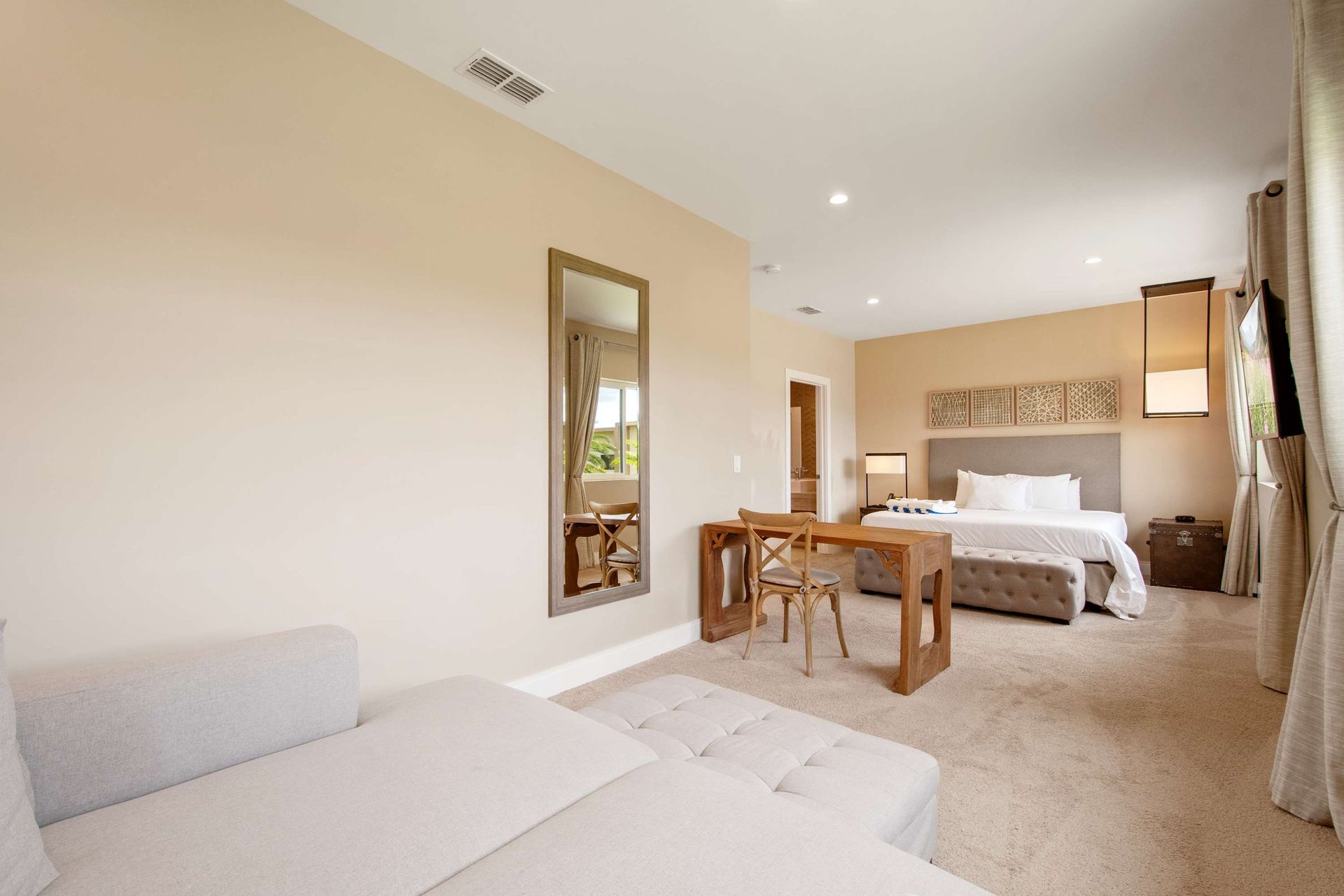 Vast King suite with a lounge area and dedicated workspace.