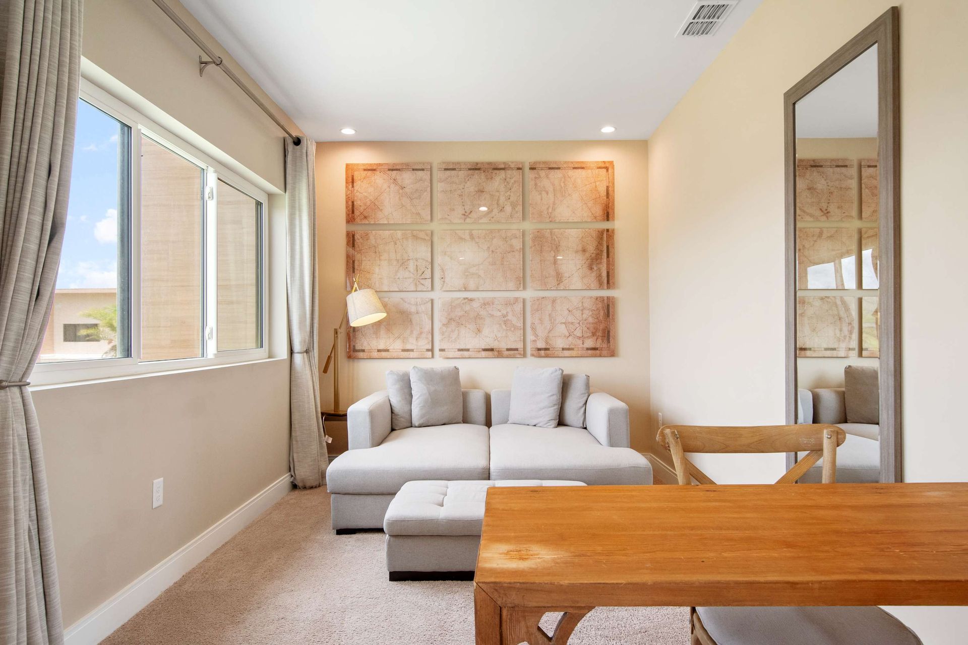 Bright upstairs loft with a cozy chaise lounge and reading light.