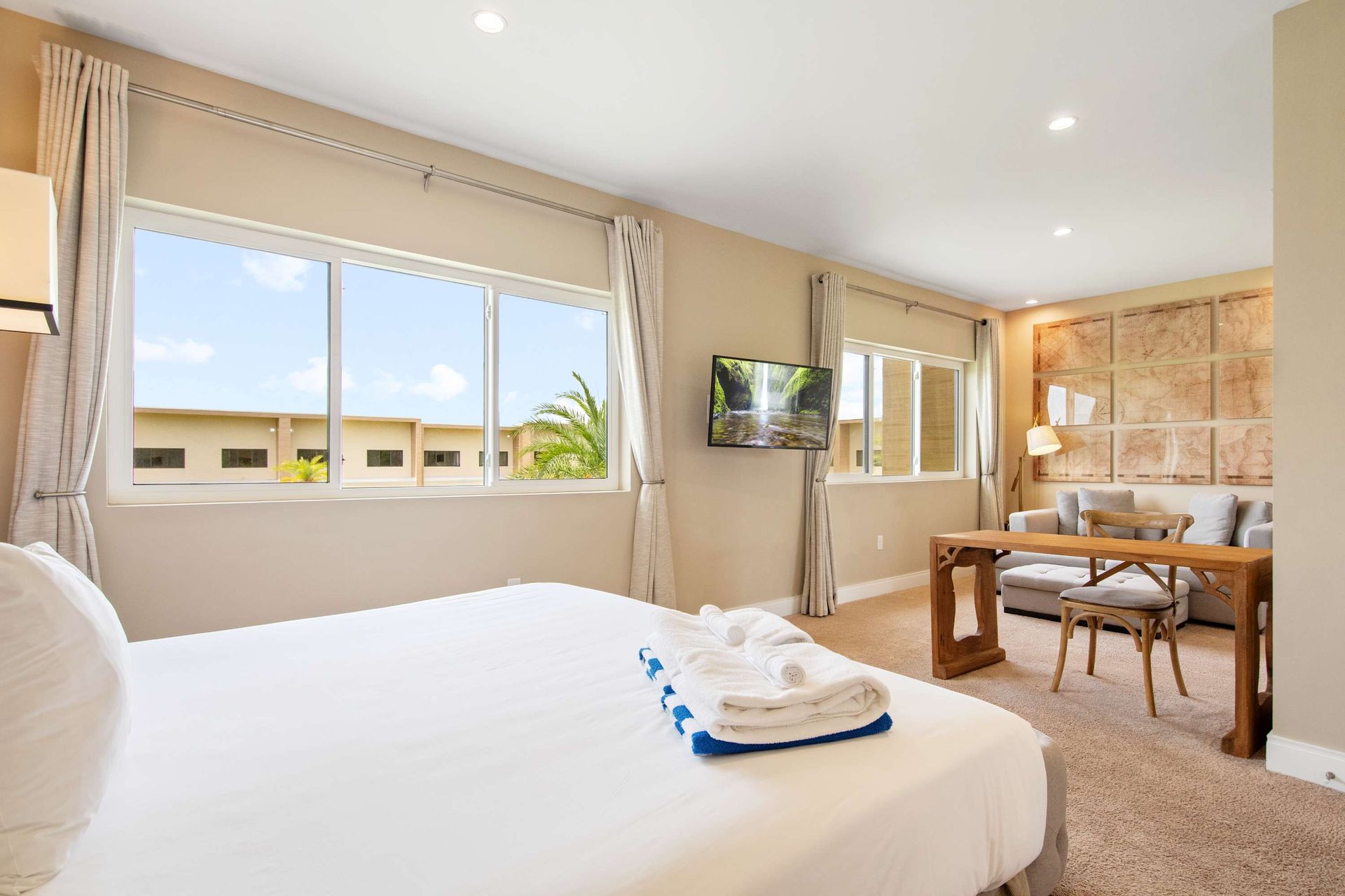 Spacious King suite with a dedicated lounge area and huge windows.