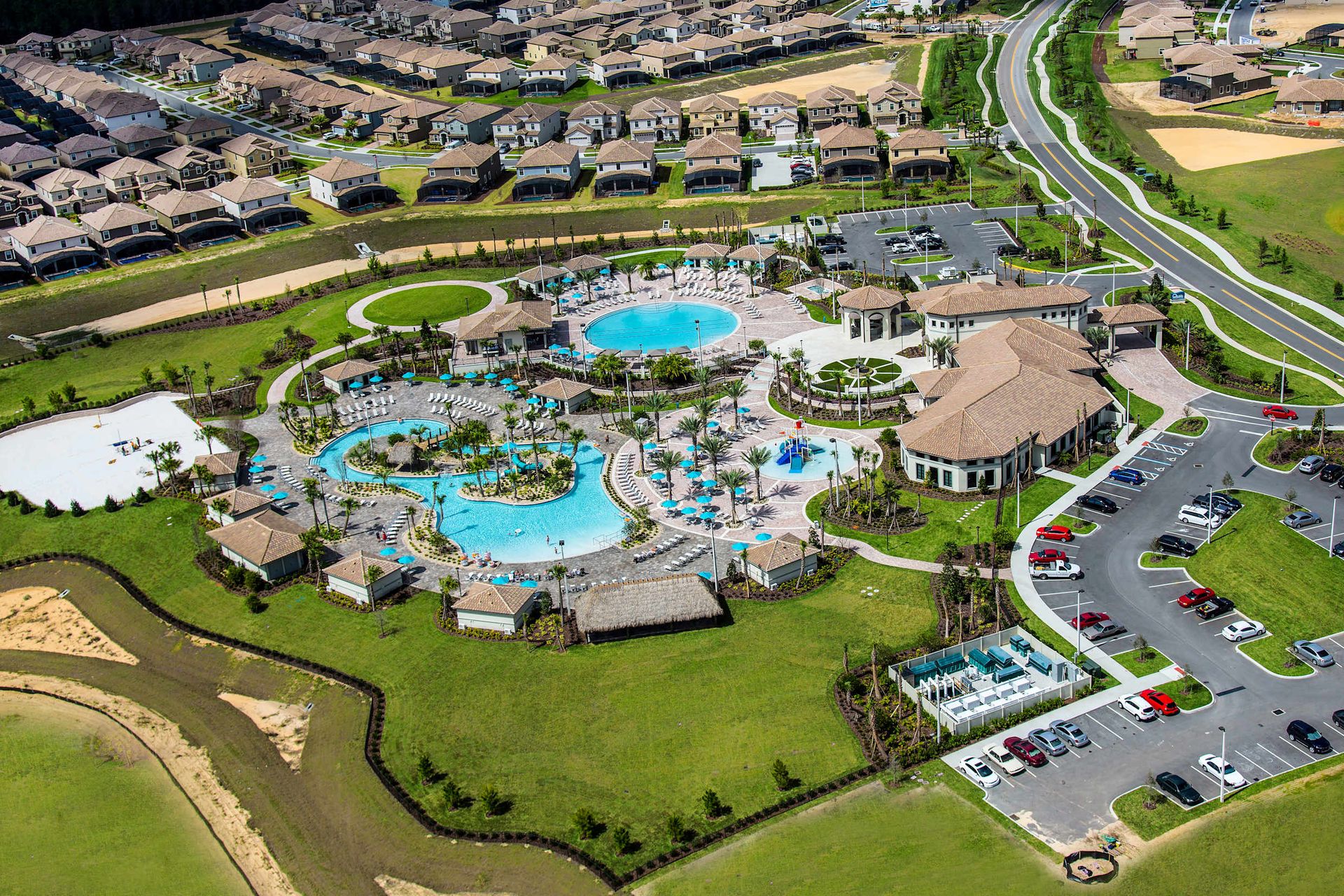Massive resort pool complex and water park with slides and lazy river.
