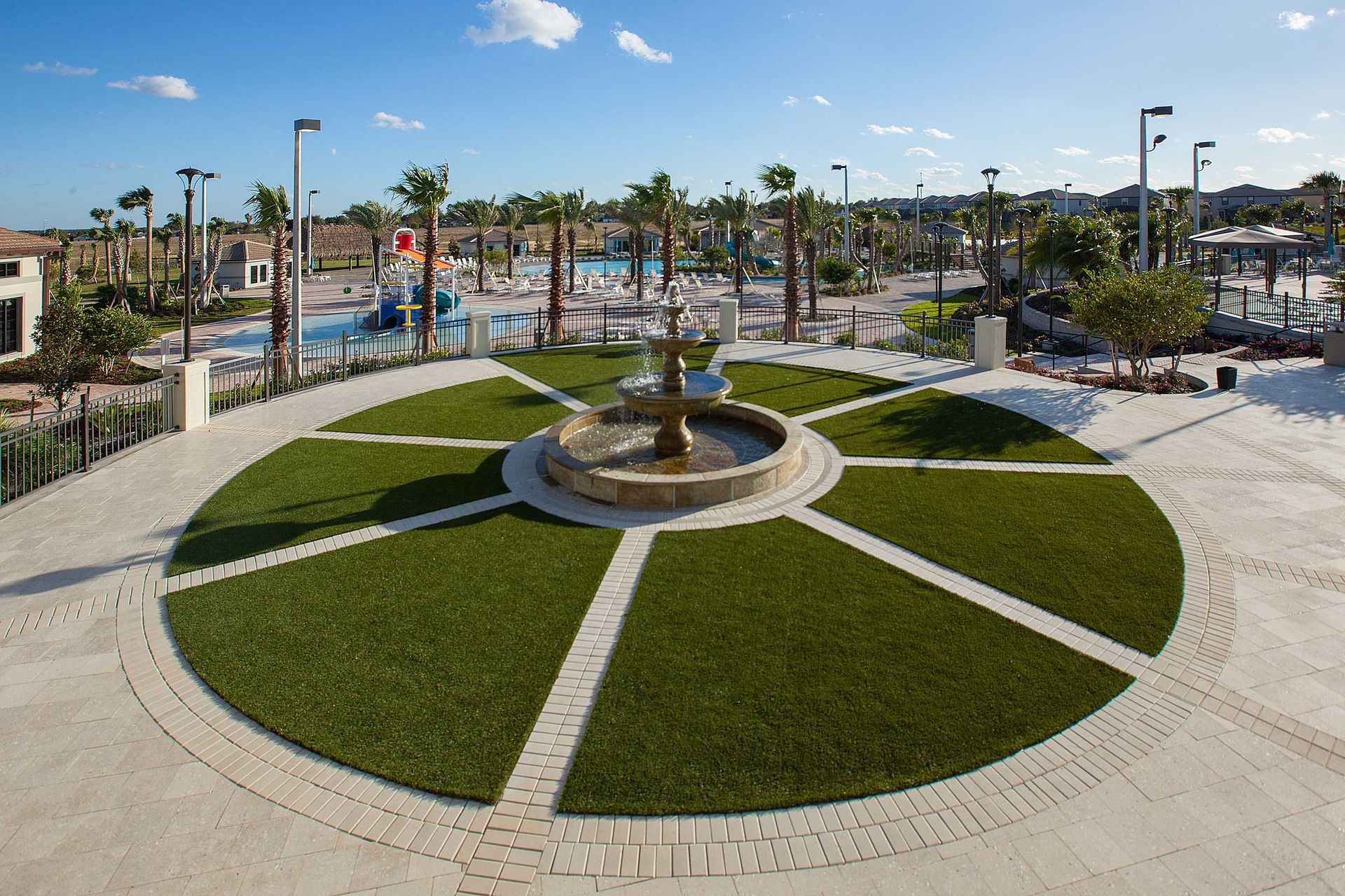 Grand fountain entrance leads to the pool deck and clubhouse.
