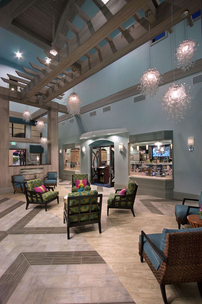 Dramatic wooden beams and stylish, comfy seating in a grand lounge.