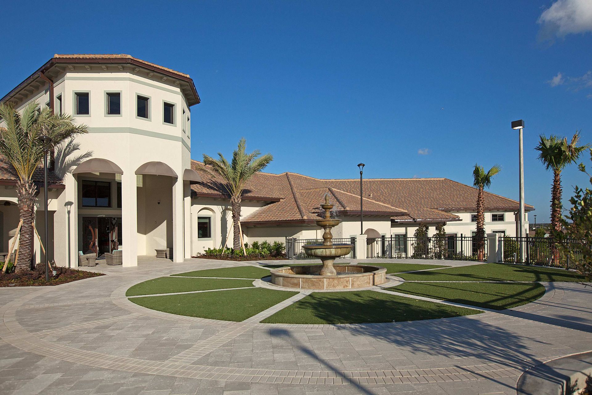 Stunning resort architecture: elegant turrets, tile roof, and wide lawns.