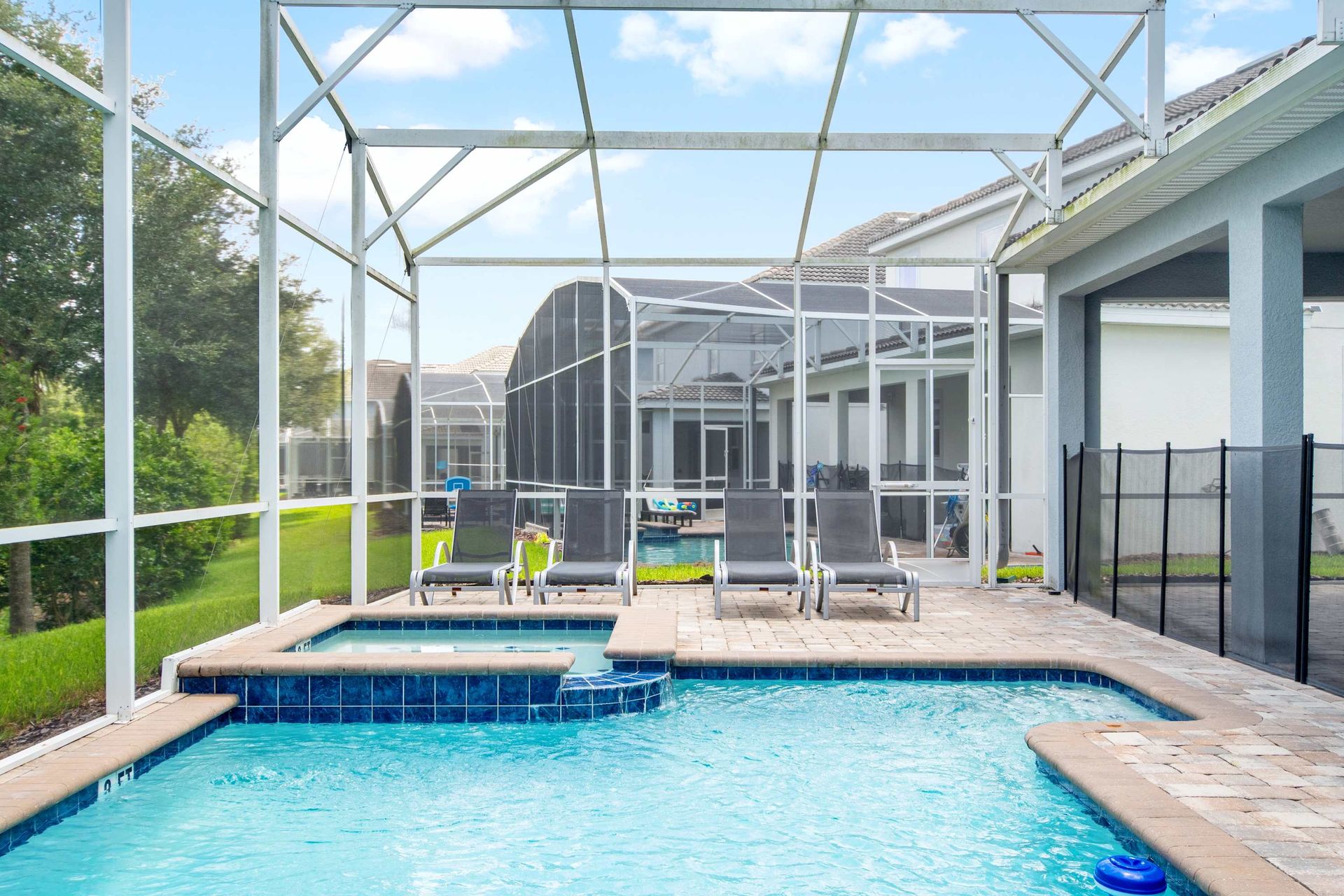Private pool, hot tub, and covered patio dining in a safe enclosure. 