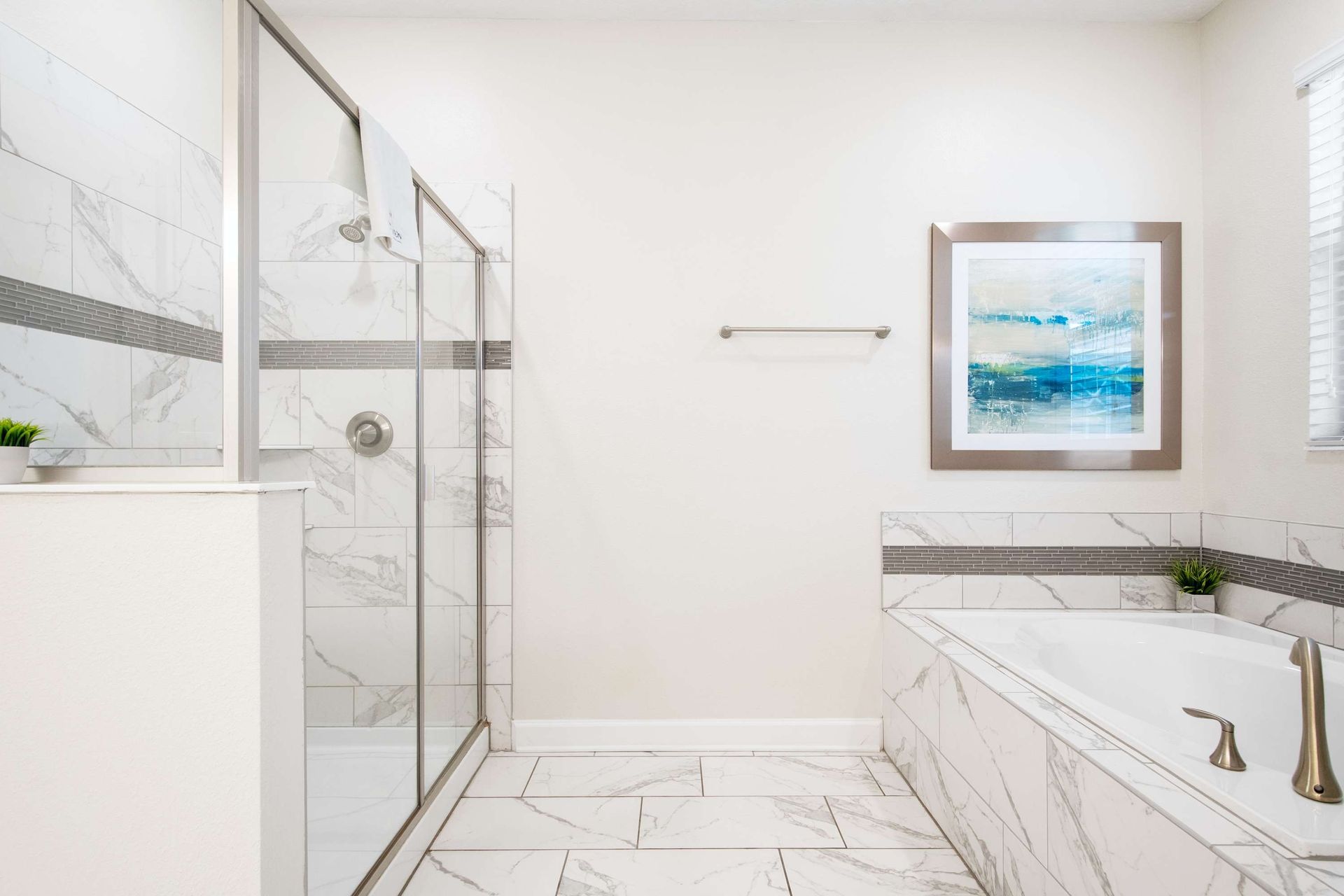 Sleek white table and modern blue chairs under stylish pendant light.