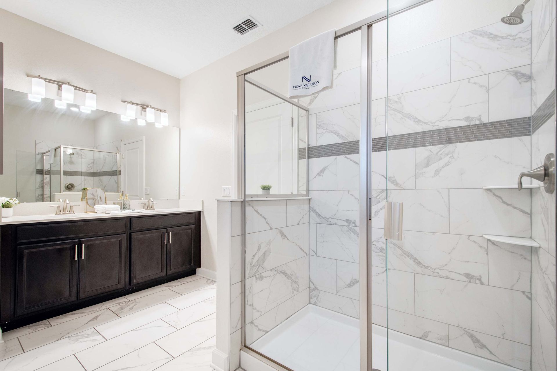 Bright dual vanity and mirror for easy morning routines.