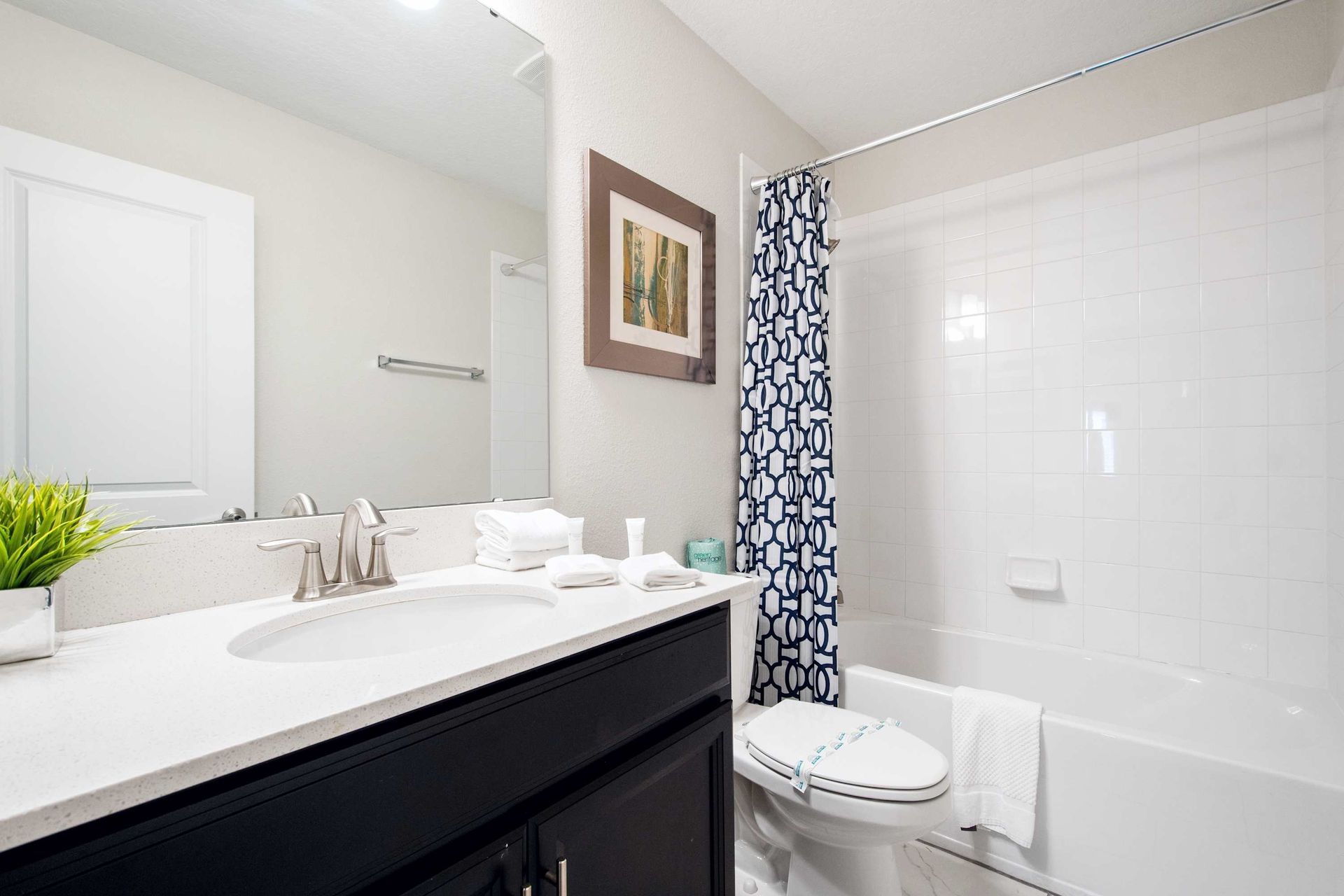 Master bath with dual vanity, granite counters, and walk-in shower.