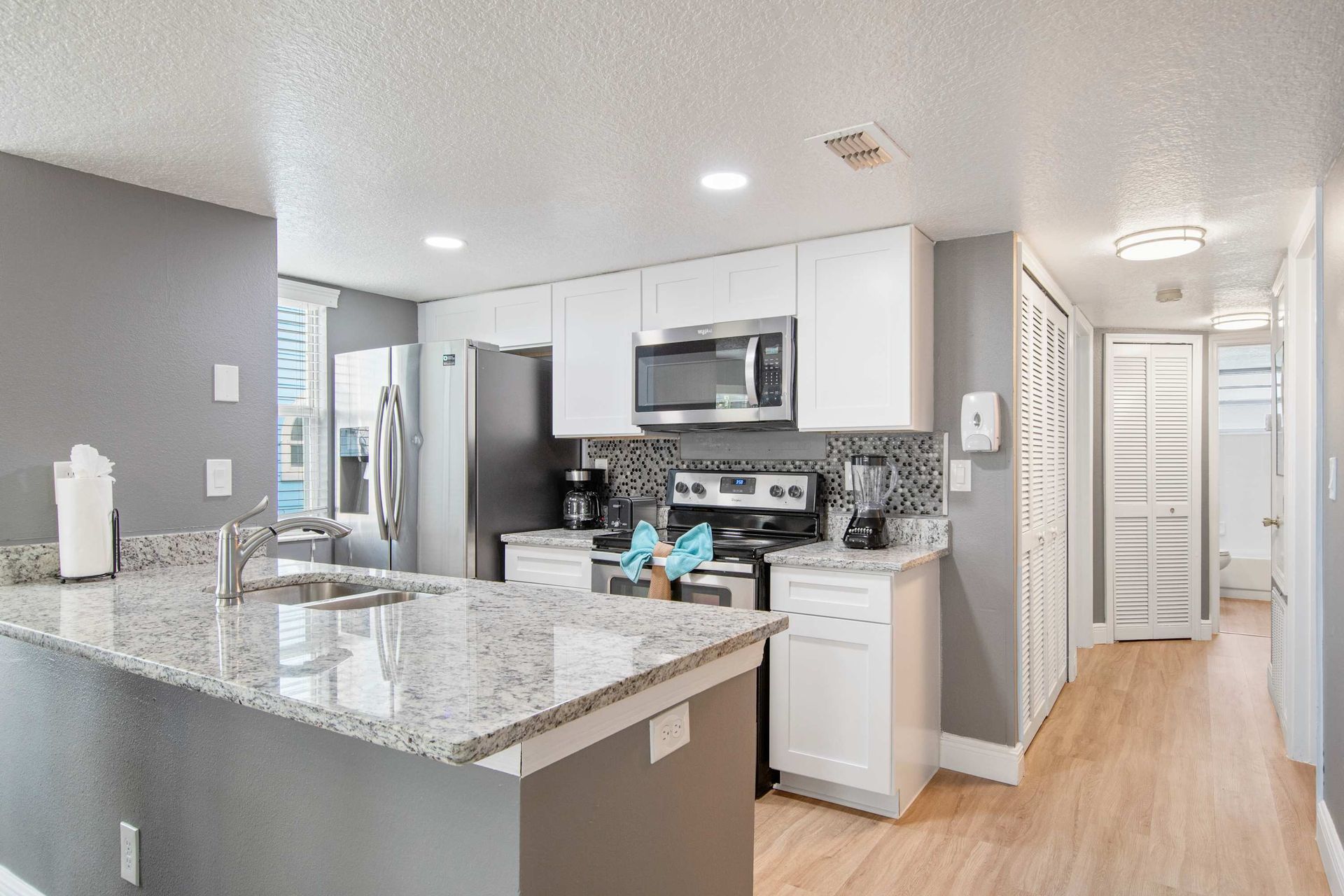 Spacious, well-equipped kitchen open to the main living area. 