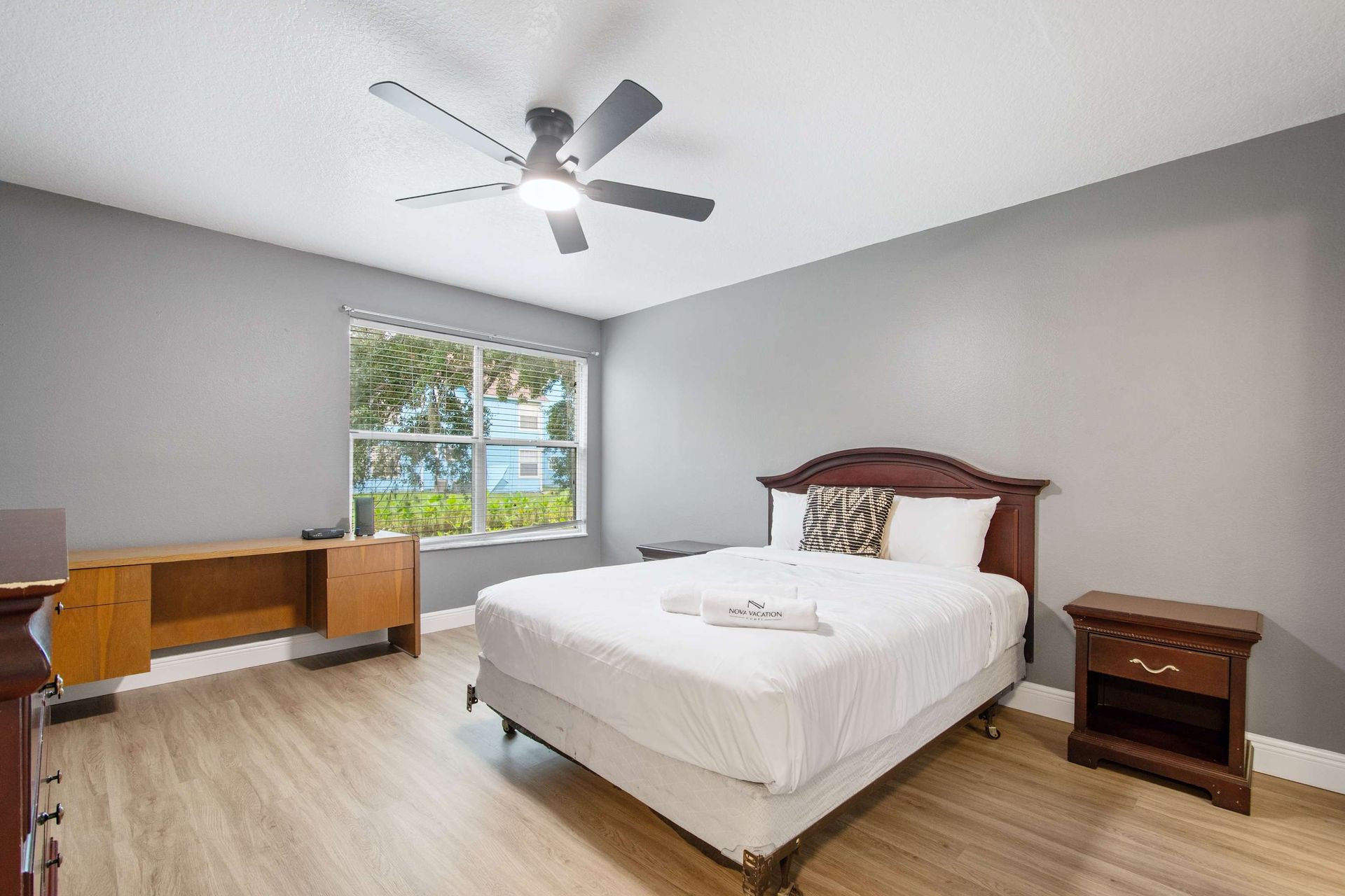 Clean gray walls and warm wood accents create a peaceful space. 