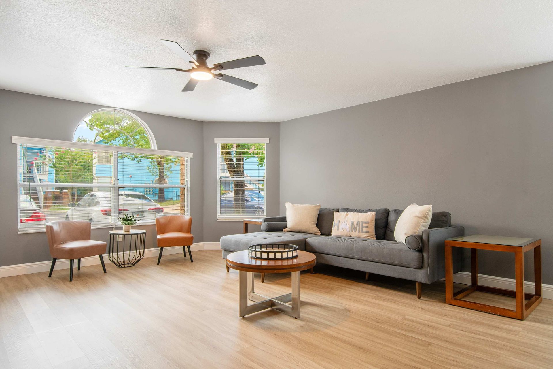 Plush sectional and chic accent chairs provide ample, comfortable seating.