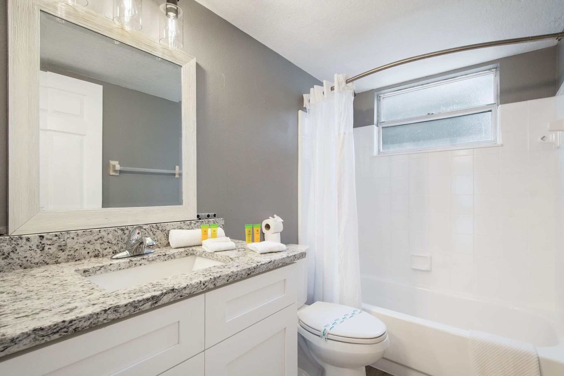 Chic gray walls and bright white accents create a crisp, clean space. 