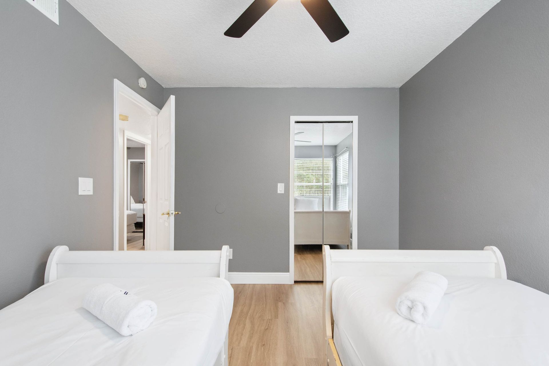 Bright, comfortable twin beds in a modern room. (