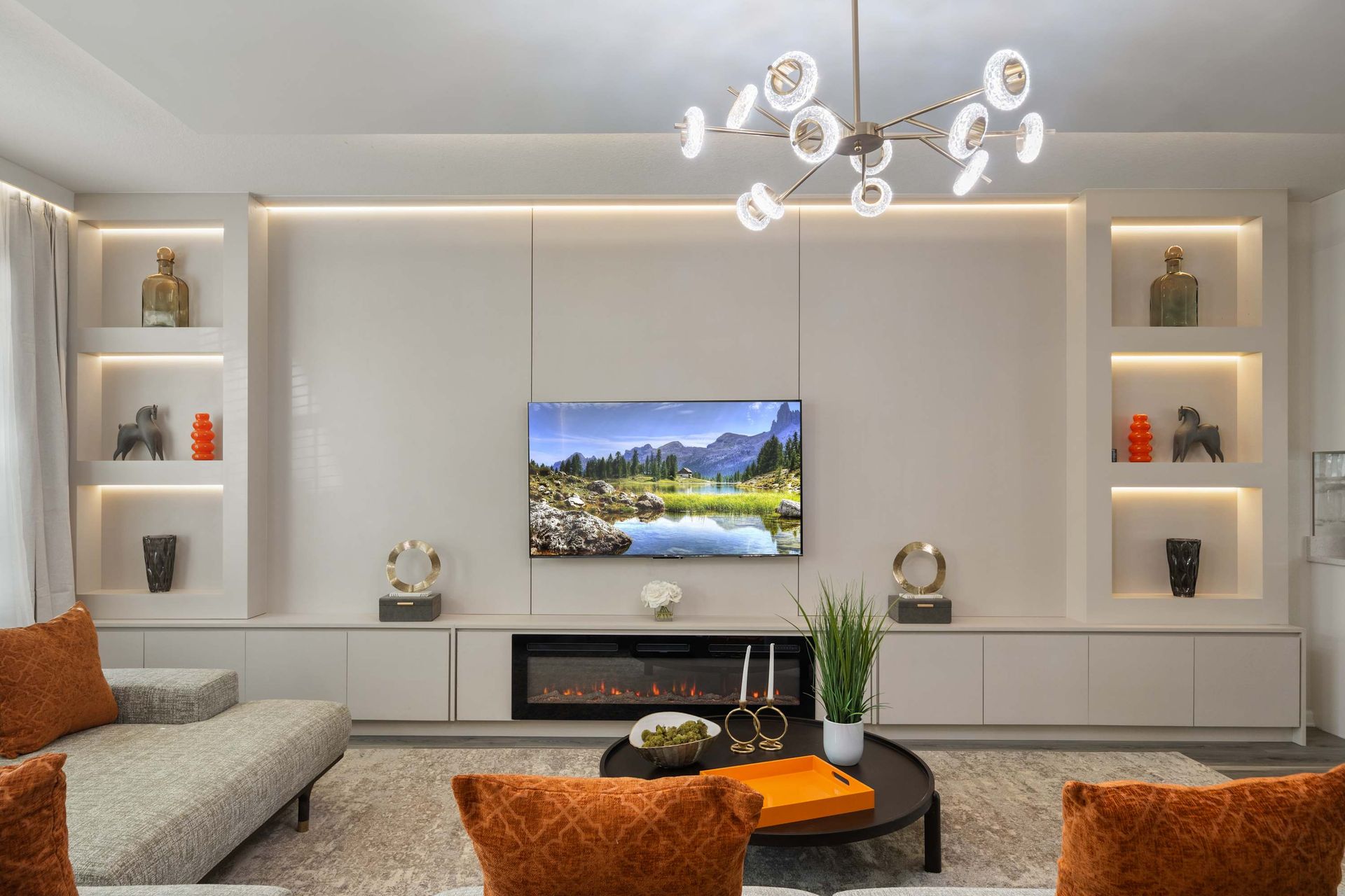 Clean lines, modern chandelier, and warm accent lighting.