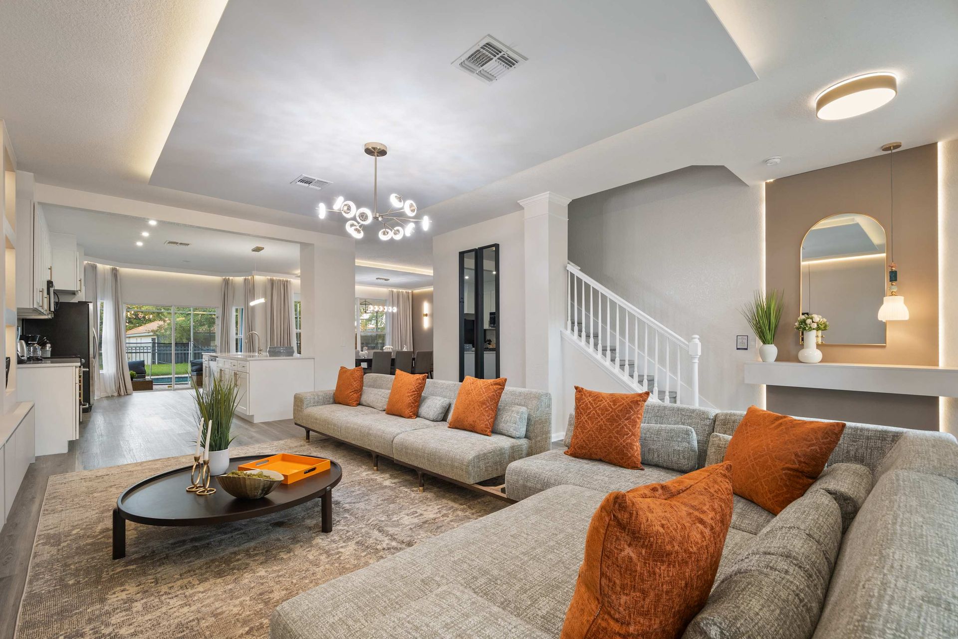 Expansive modern living room flowing to the outdoor patio.
