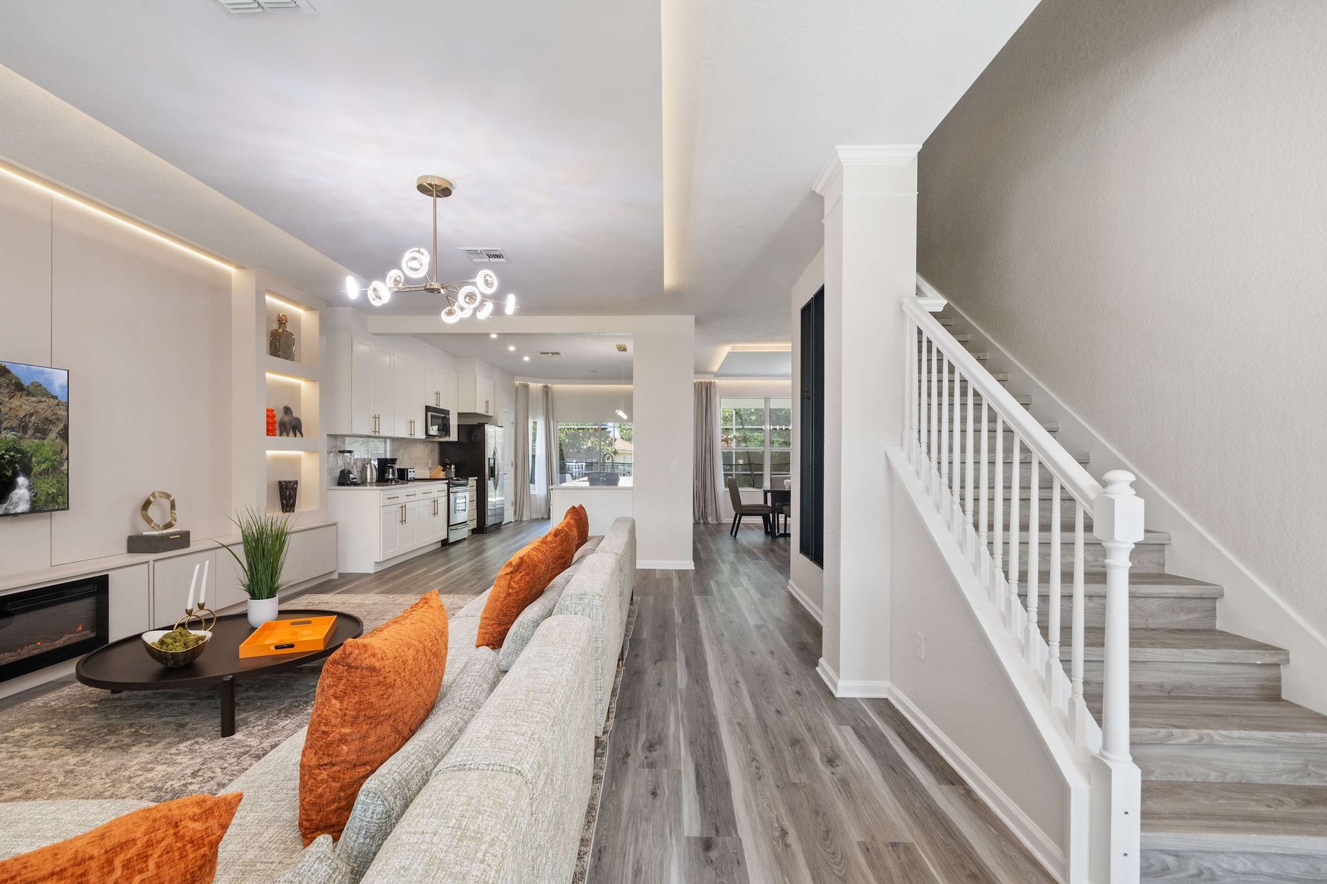 Spacious, modern design with chic lighting and continuous flooring.