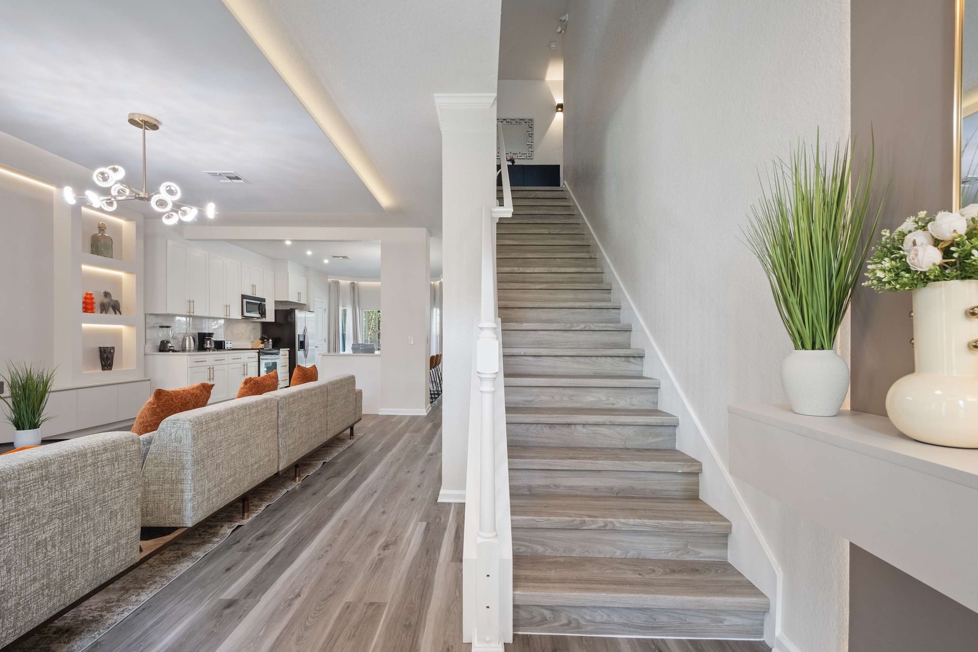 Stylish entry and stairs leading to bright, modern living.