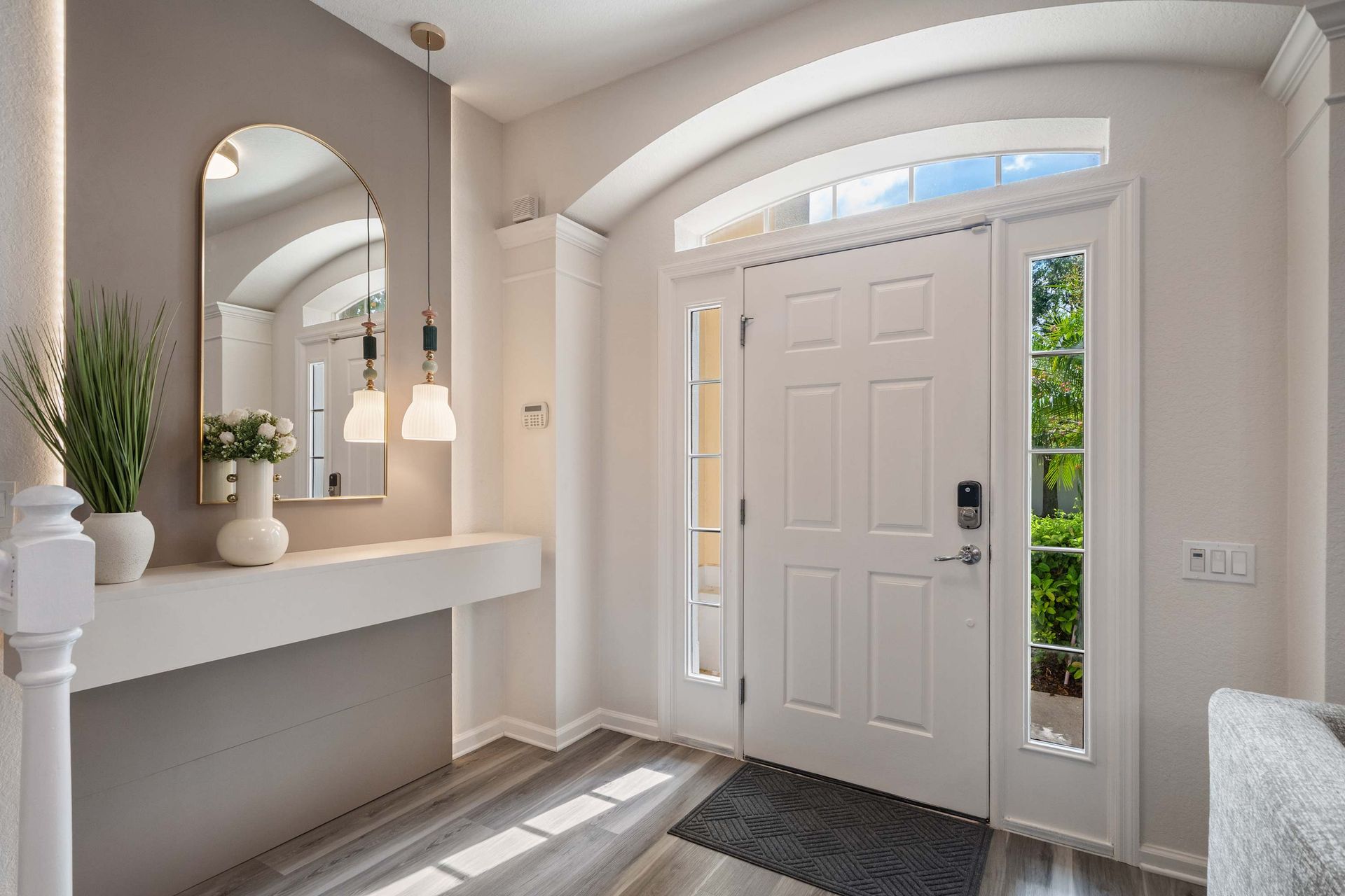Elegant entryway with natural light and minimalist decor.