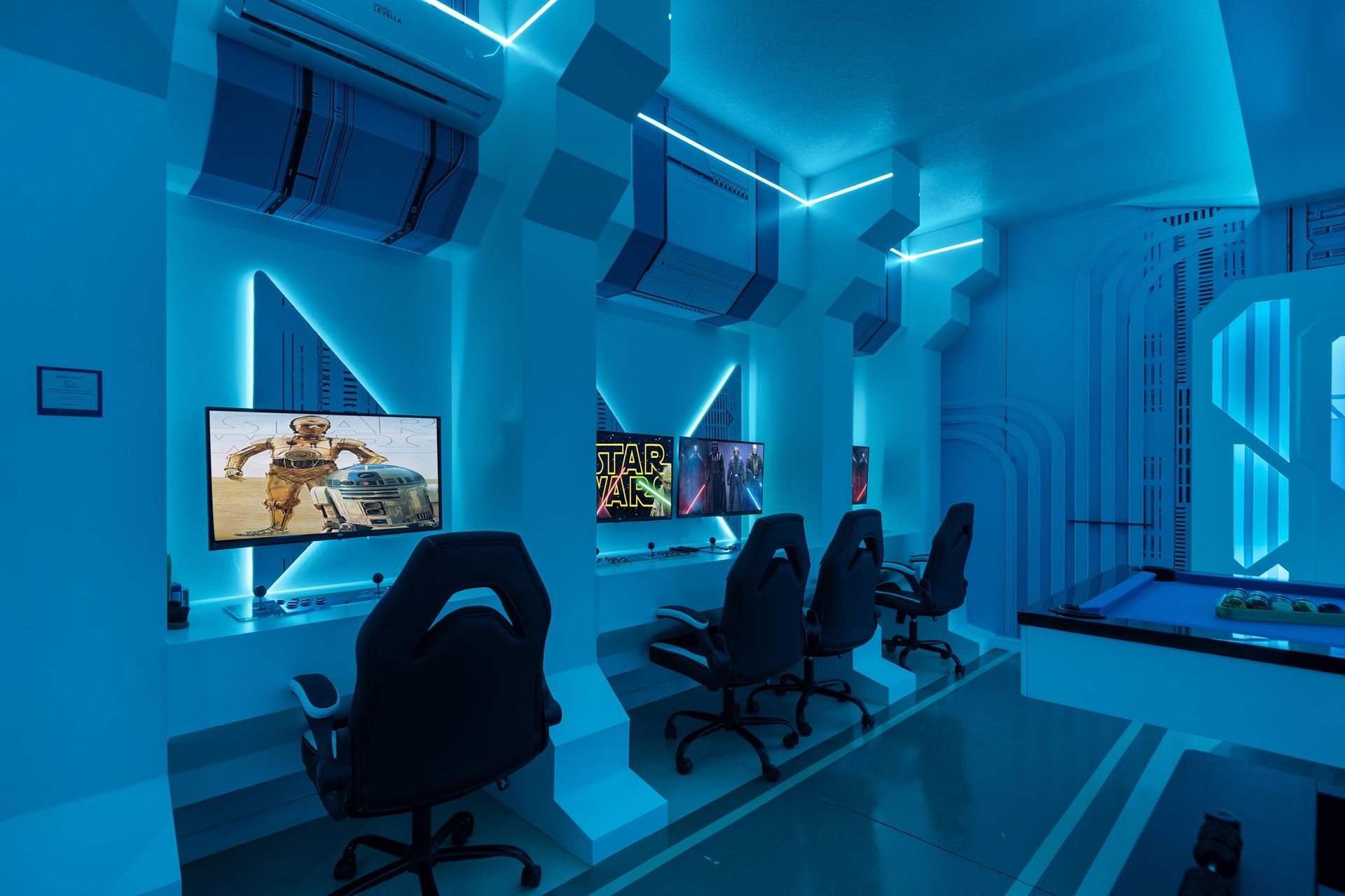 Ultimate gaming experience with multiple screens and blue light.
