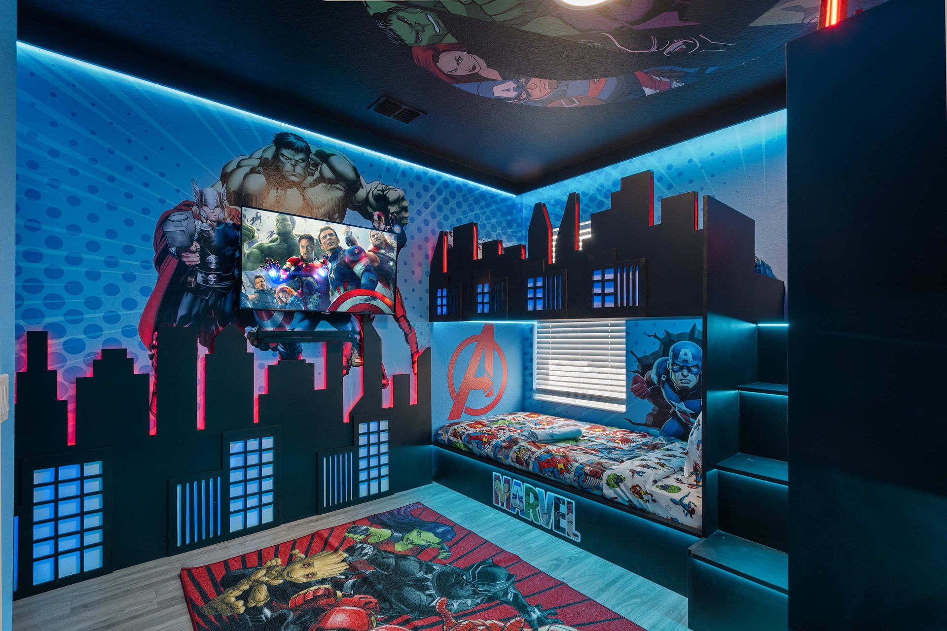 Epic superhero themed bedroom with bunk beds and TV. 