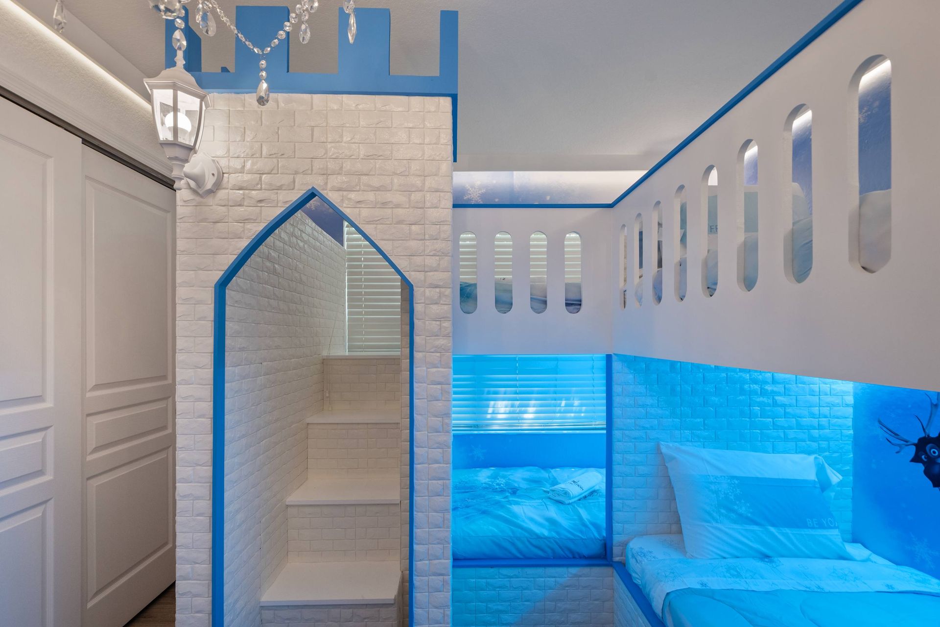 Custom castle bunk beds with white brick texture.