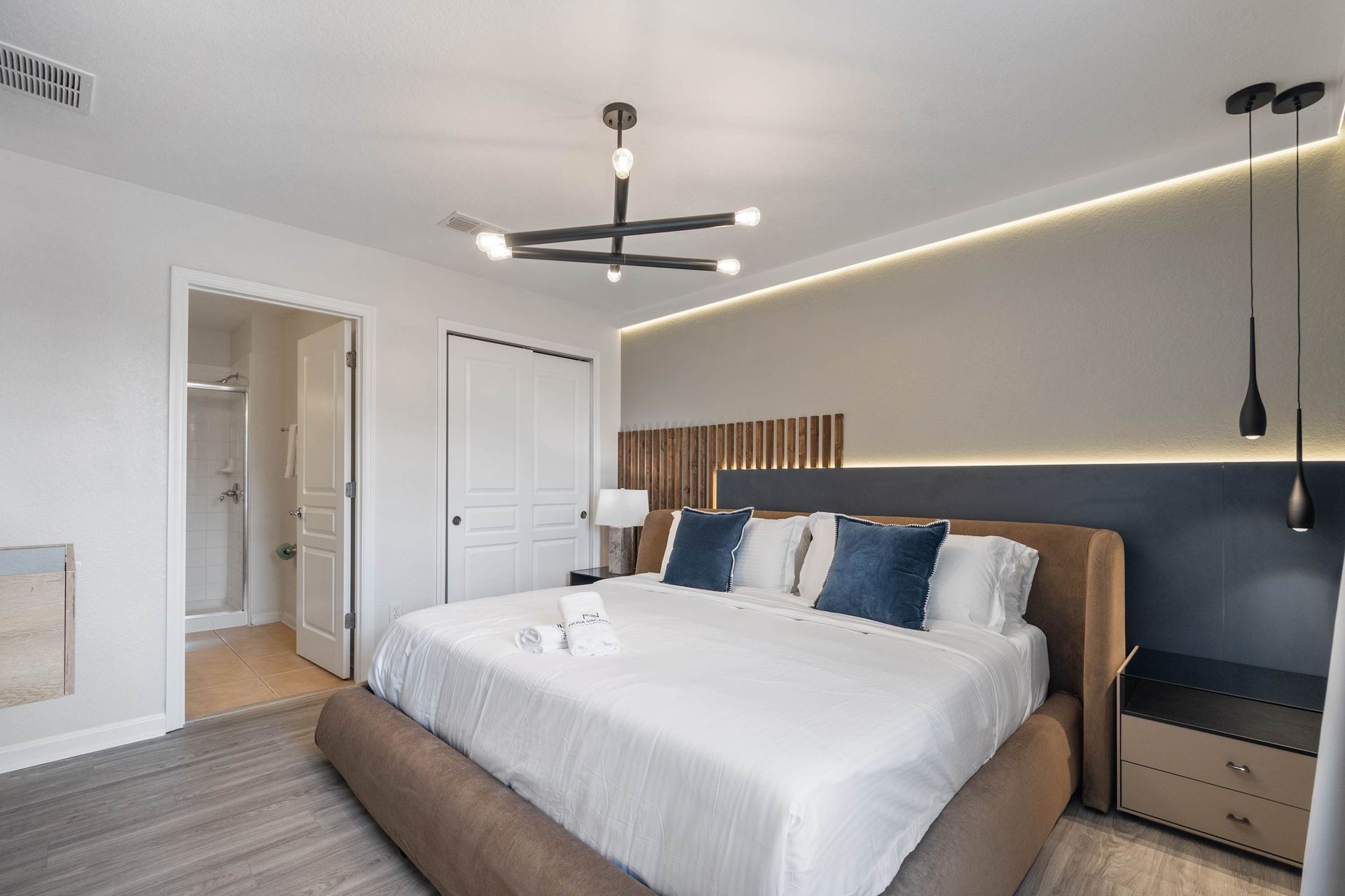 Luxurious king bed, chic design, and private ensuite access. 