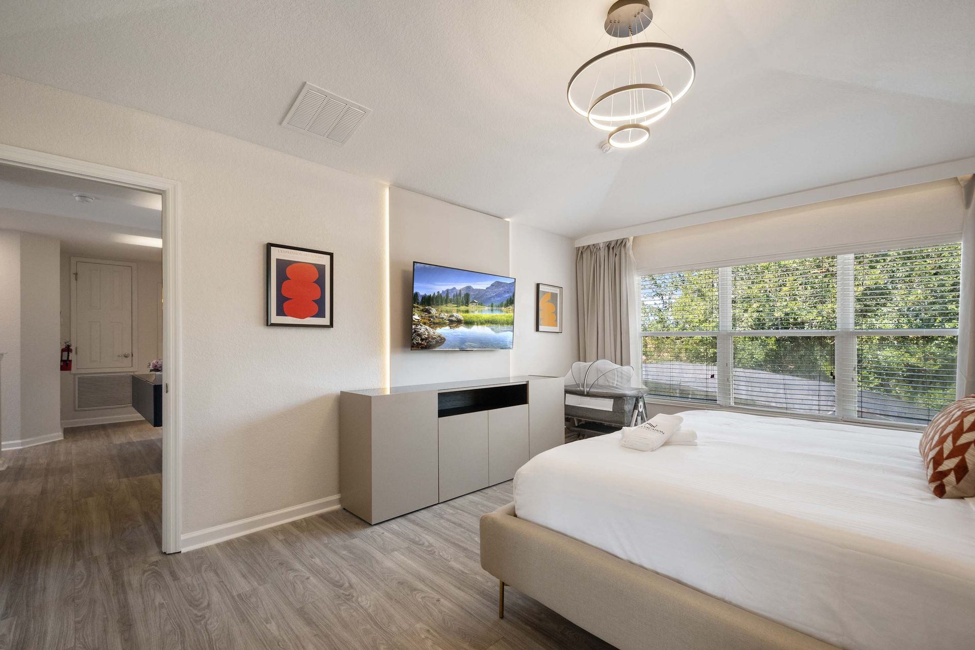 Sleek modern suite with ambient lighting and huge windows. 