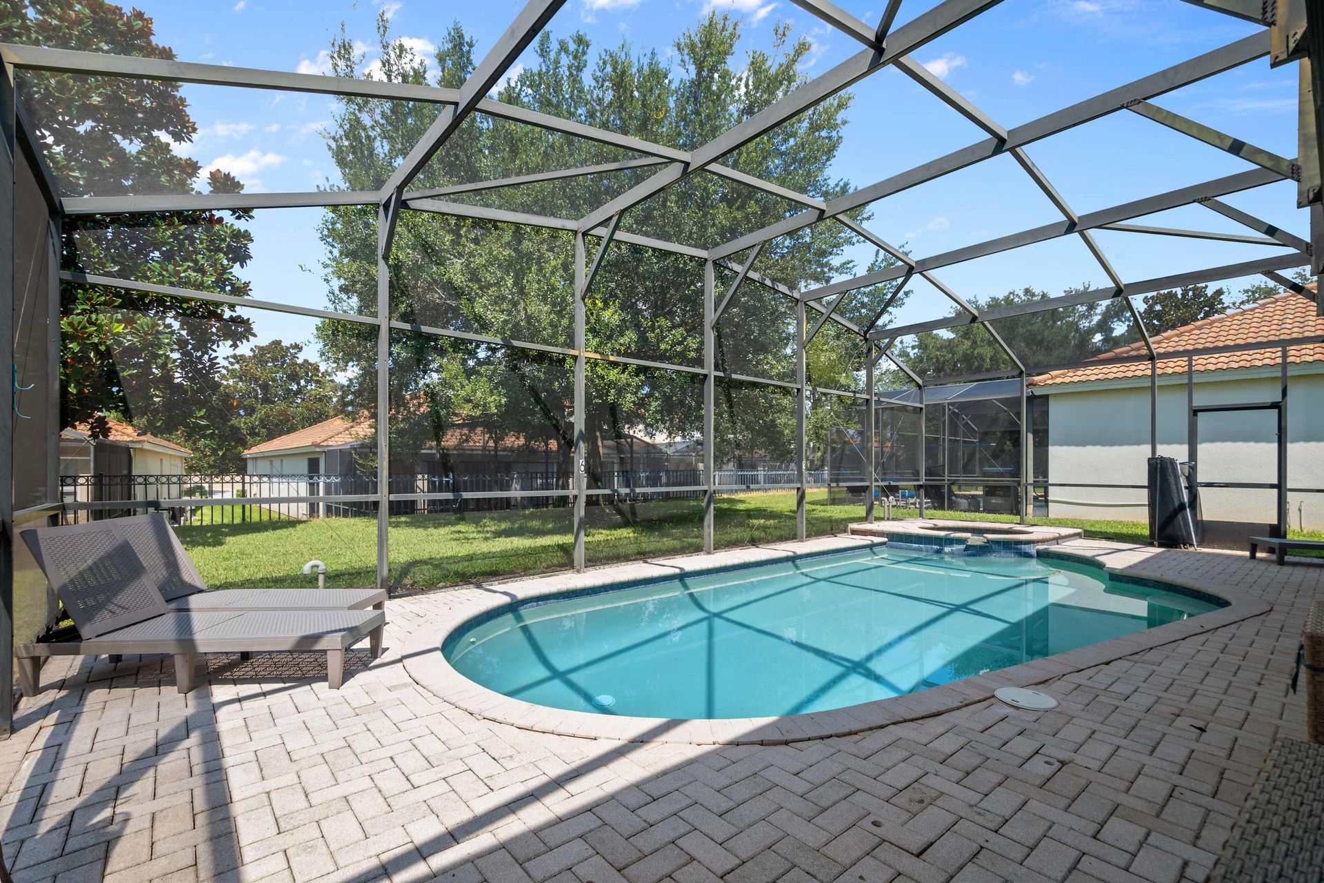 Private, screened pool deck and spa, perfect for safe fun in the sun.