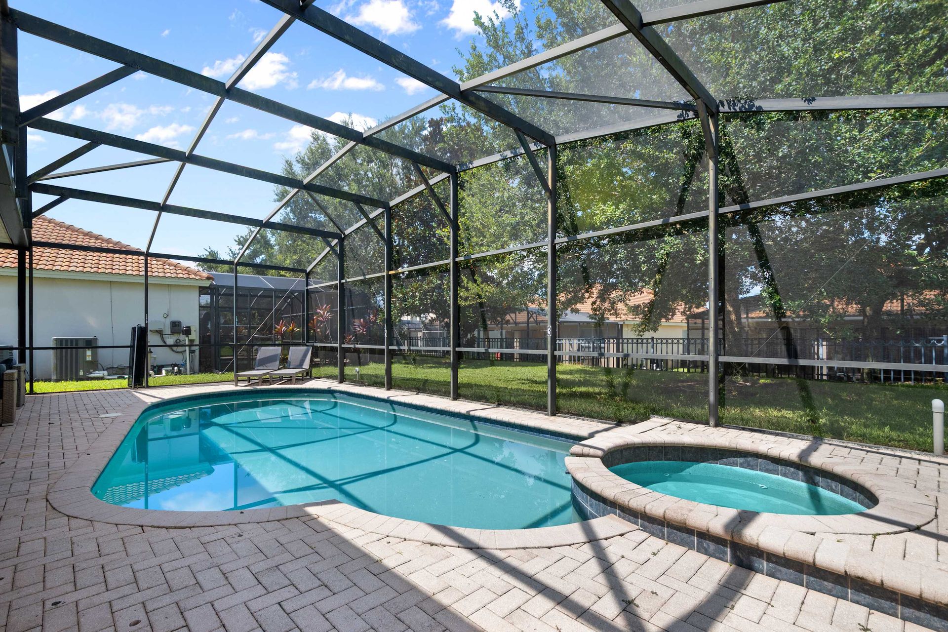 Relaxing pool and hot tub area perfect for year-round enjoyment. 