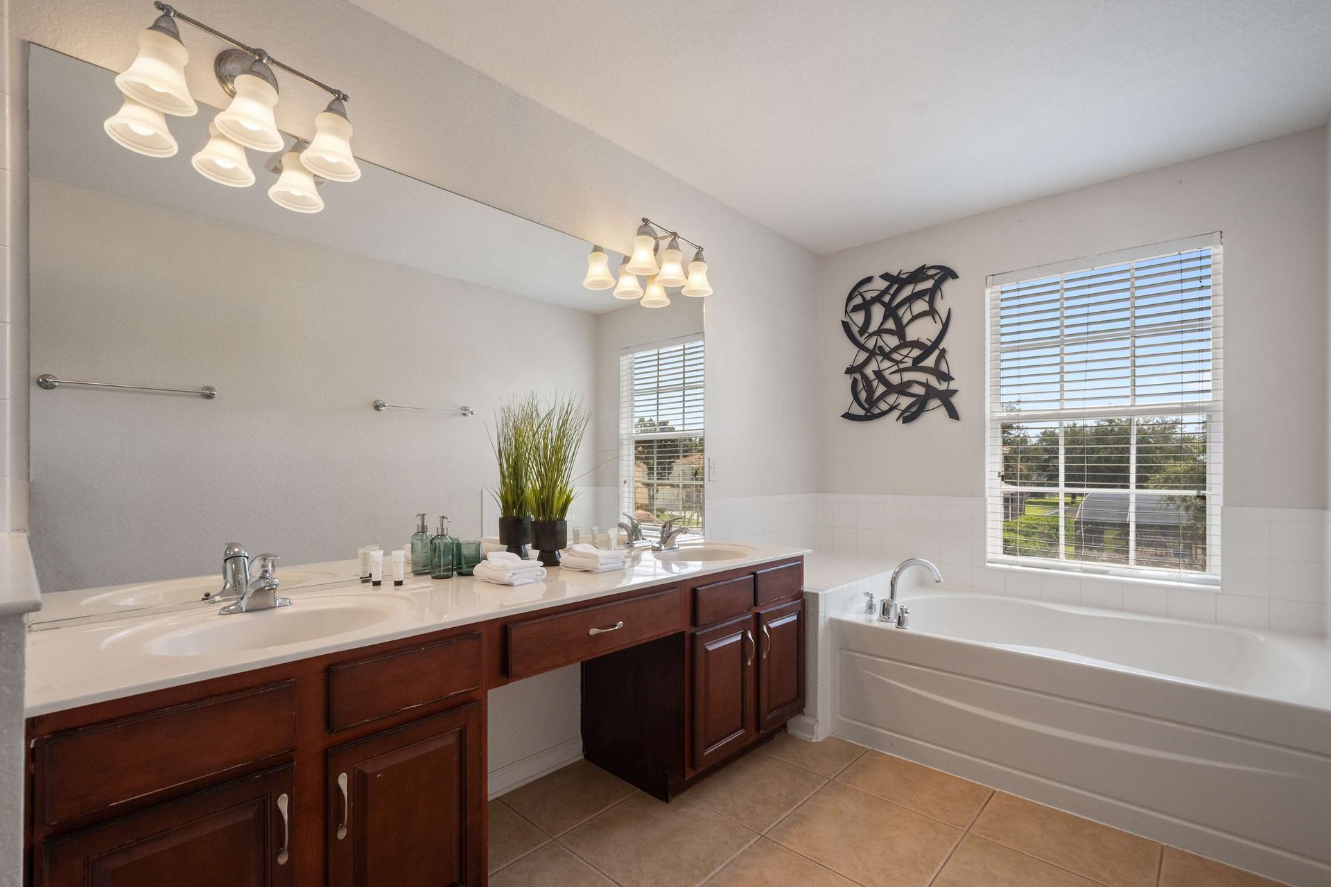 Dual vanity and soaking tub in a spacious, sunny master bath. 