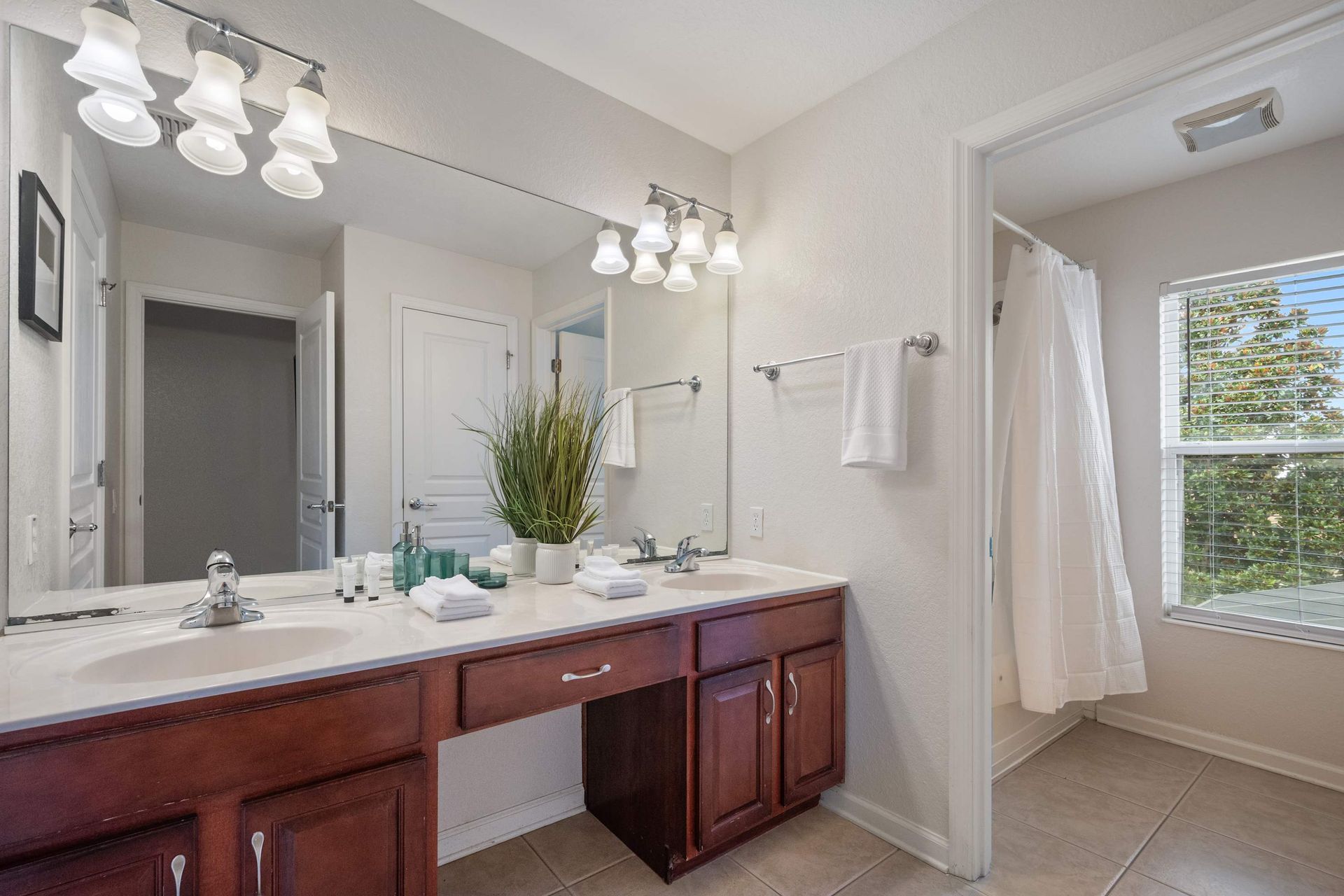 Dual sinks and large vanity make morning routines easy.