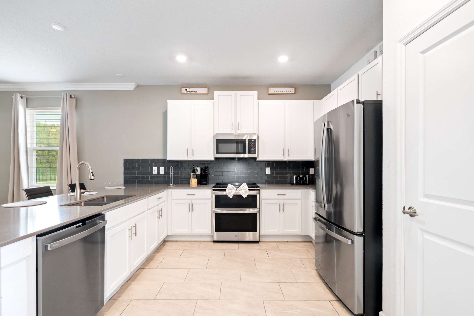 Bright, clean kitchen with modern appliances.
