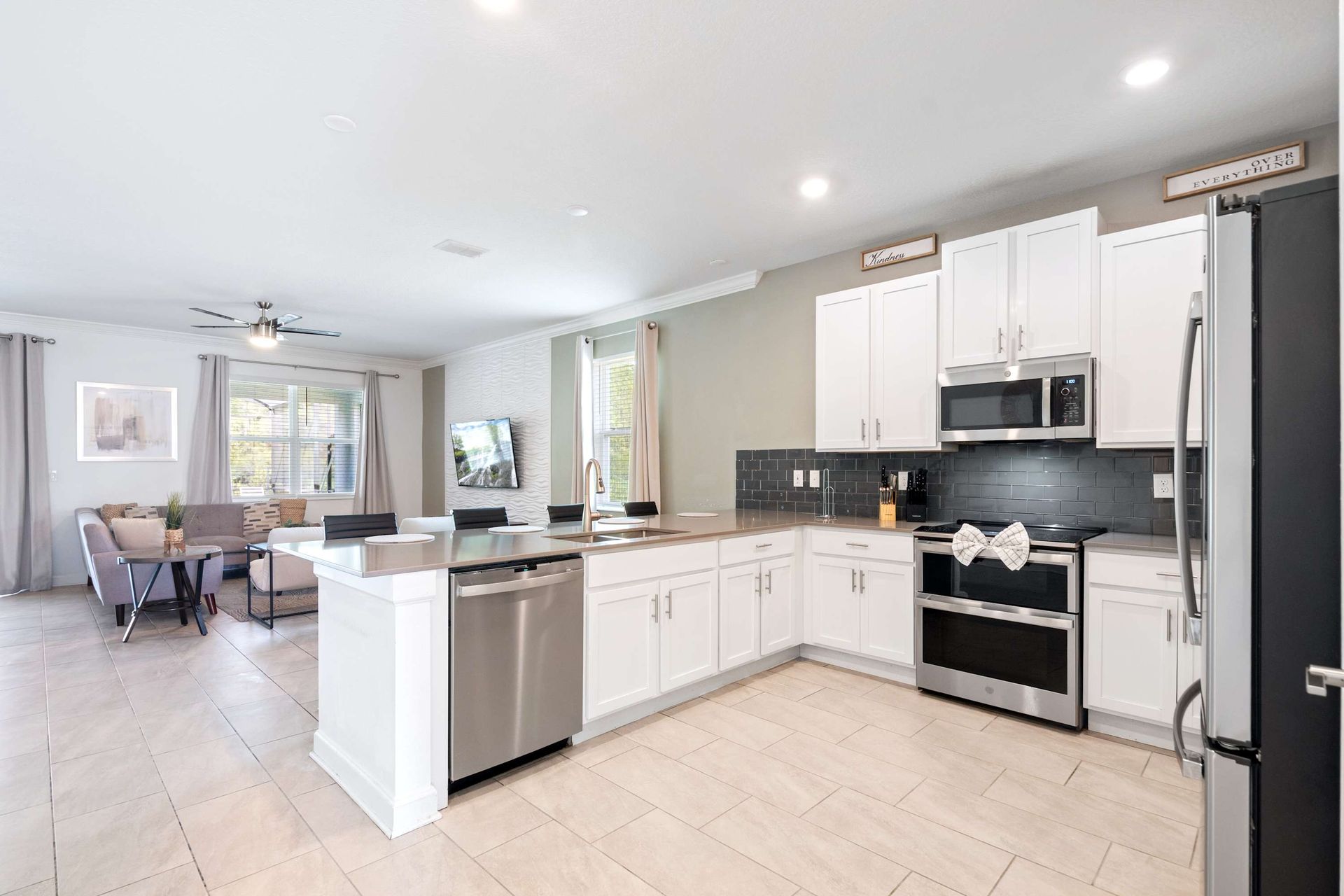 Bright, modern kitchen fully equipped and ready for guests. 