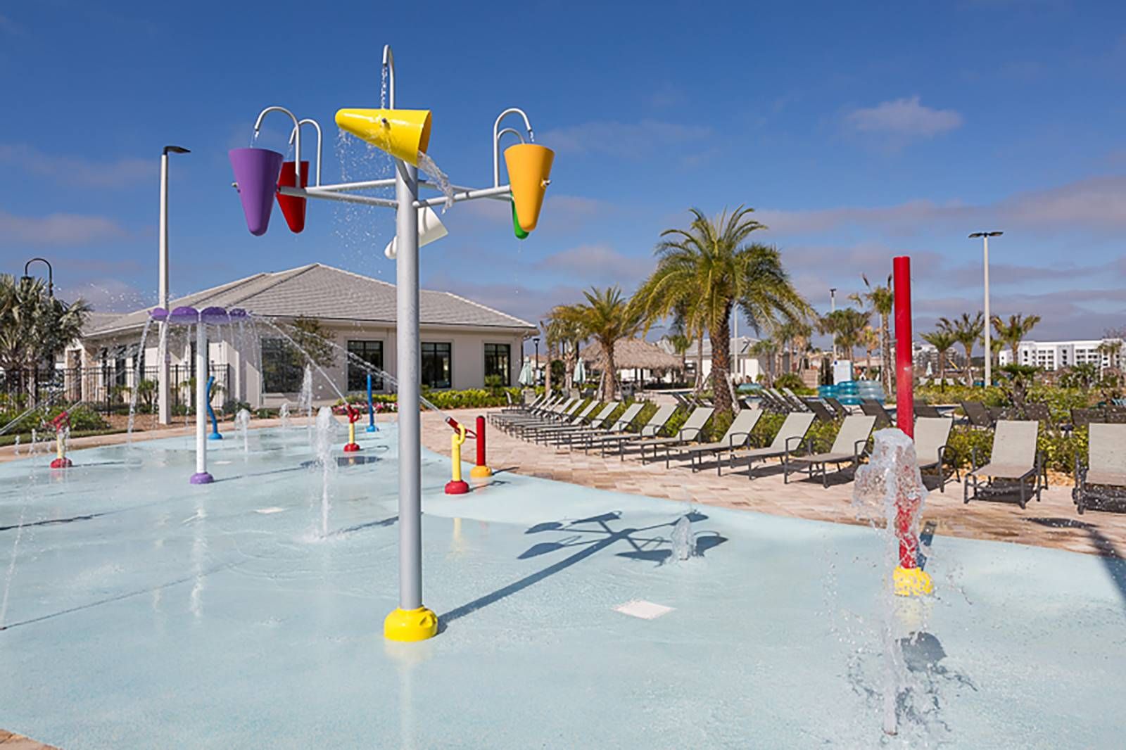 Fun in the sun! Colorful splash pad and dumping buckets for the kids.