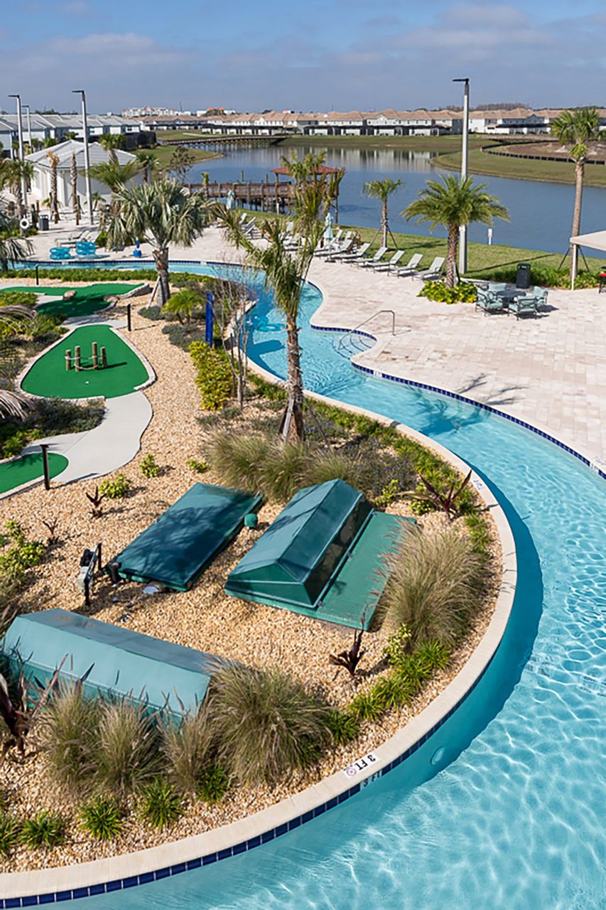 Lazy river, miniature golf, and sun loungers for resort fun.