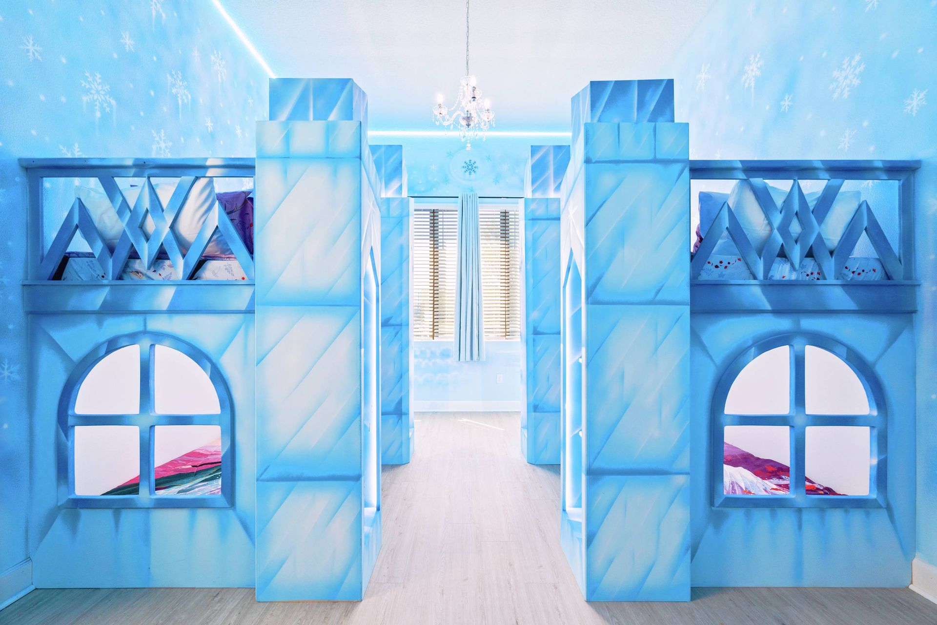 A true ice palace! Crystal blue walls and custom castle bunks.