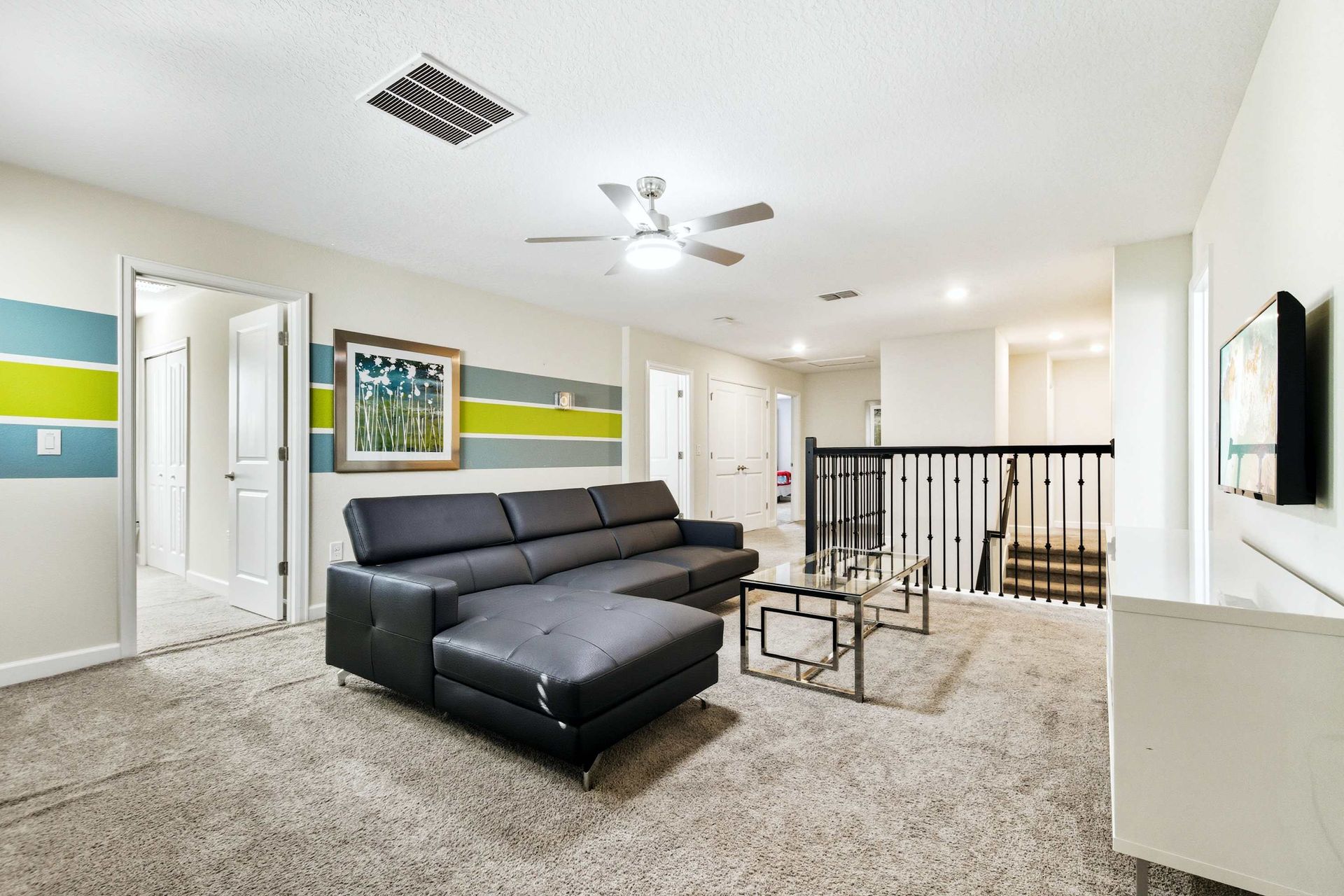 Cozy sectional sofa in the upstairs lounge with fun accent colors.