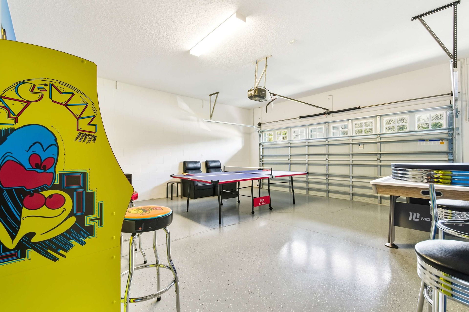 Arcade cabinets and table games in a fun, themed space.