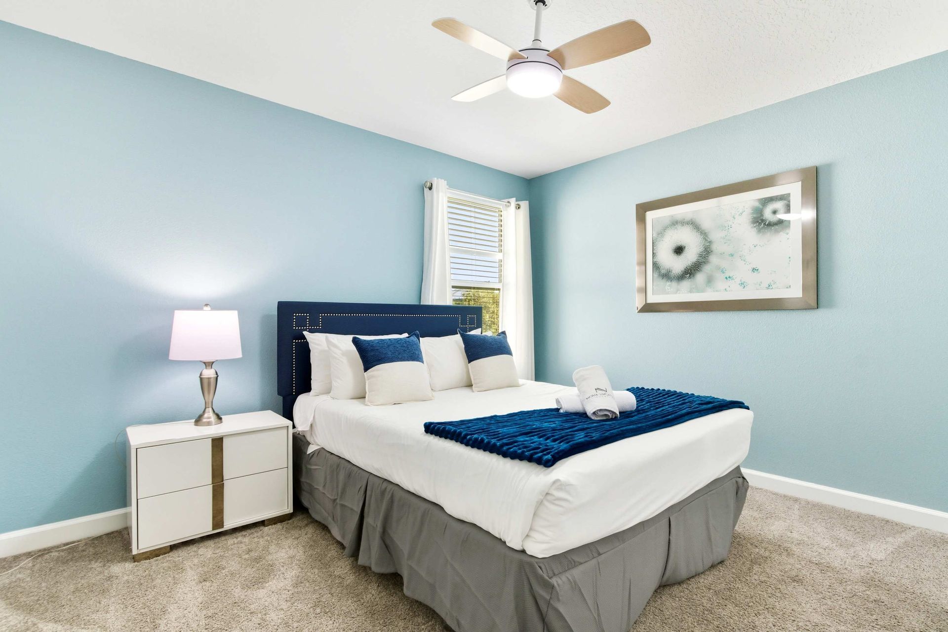 Comfy Queen suite with ceiling fan and direct access to the loft lounge.