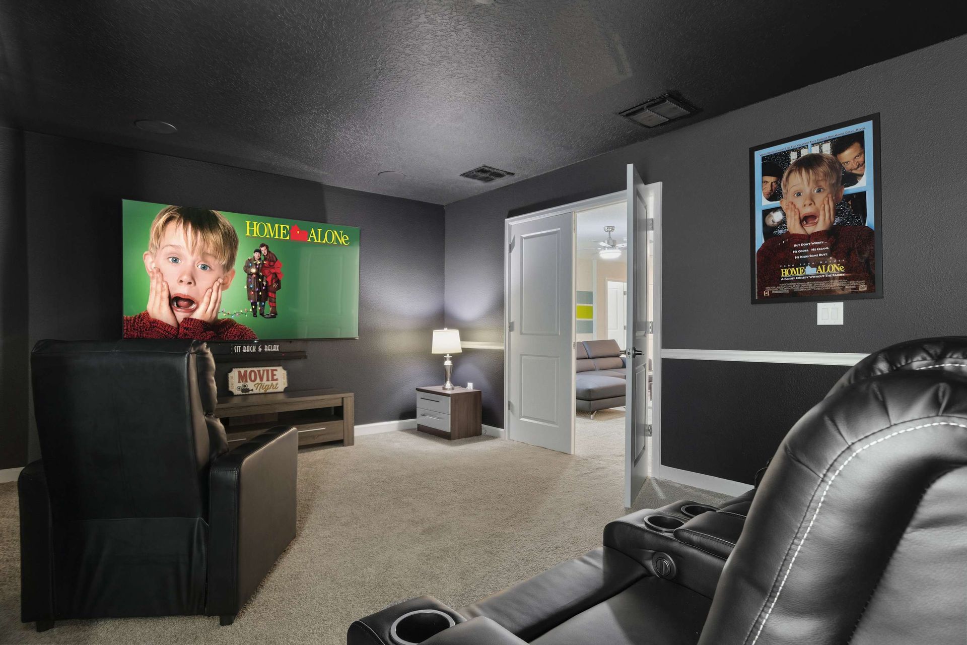 Movie night ready! Dedicated cinema with huge screen and comfy seating.