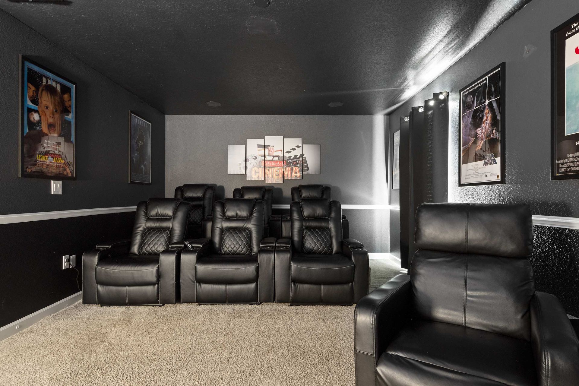 Ultimate home cinema with tiered reclining seats.