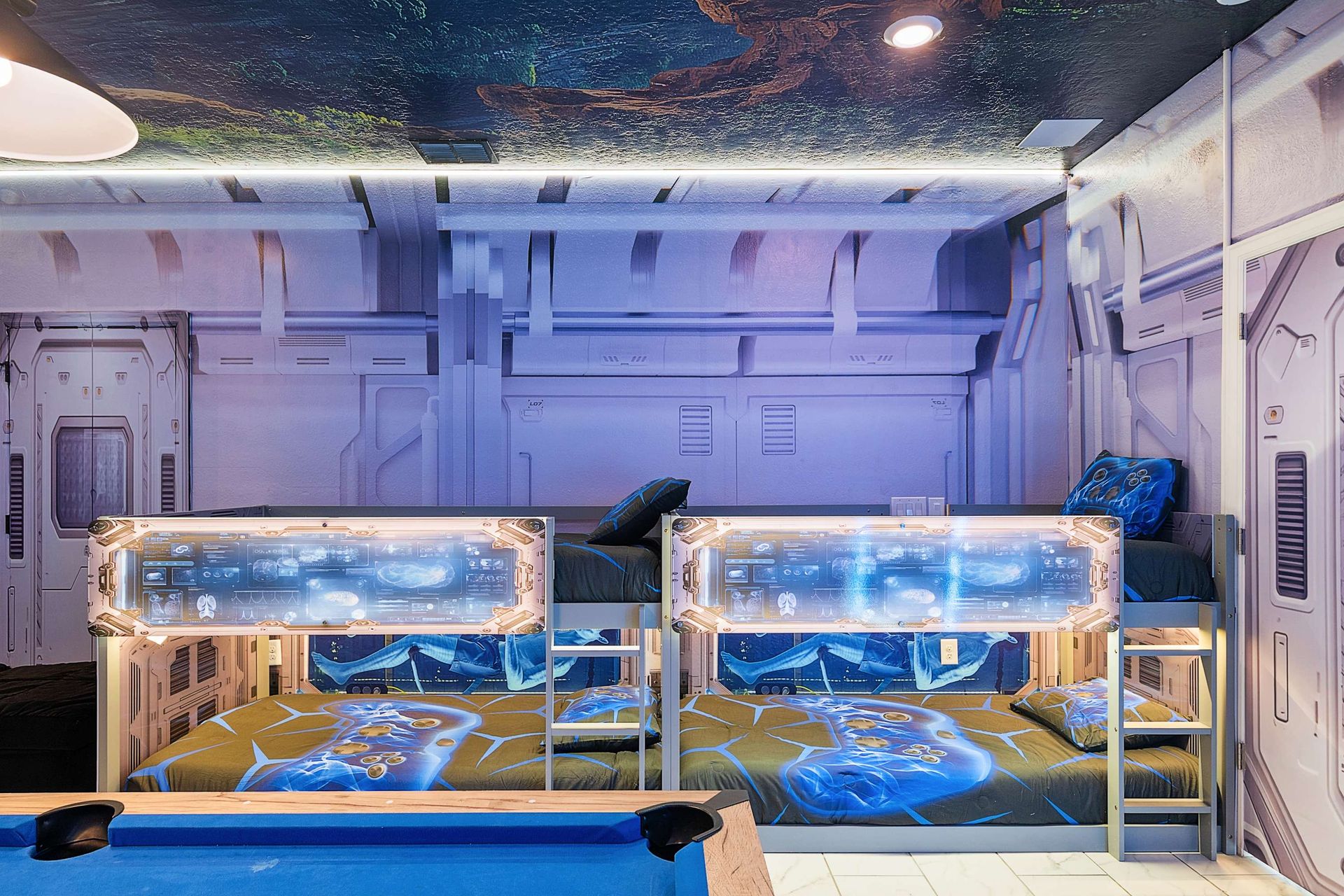 Sleep like a space explorer in these futuristic bunk pods featuring LED lights and detailed artwork — the perfect themed retreat near Disney.