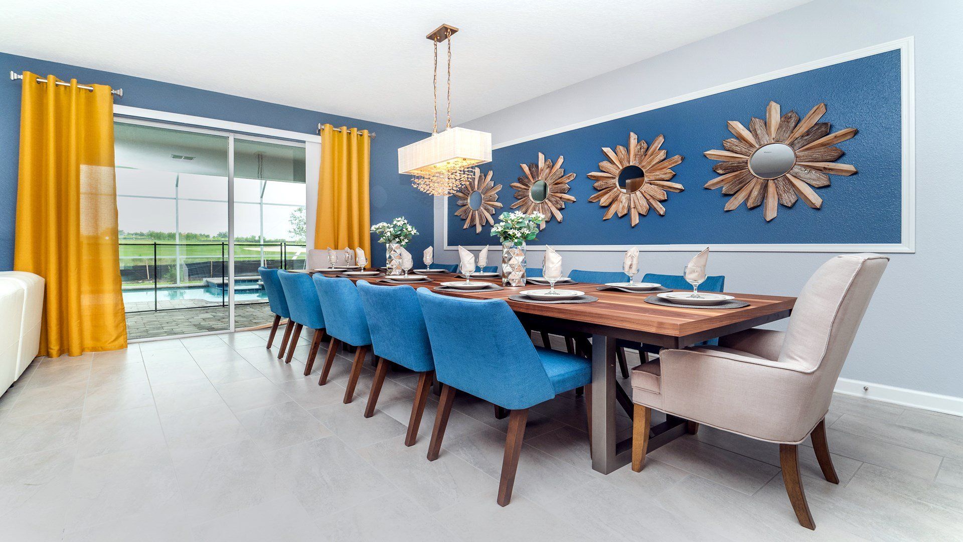 Elegant dining area with seating for 10, stylish decor, and pool views