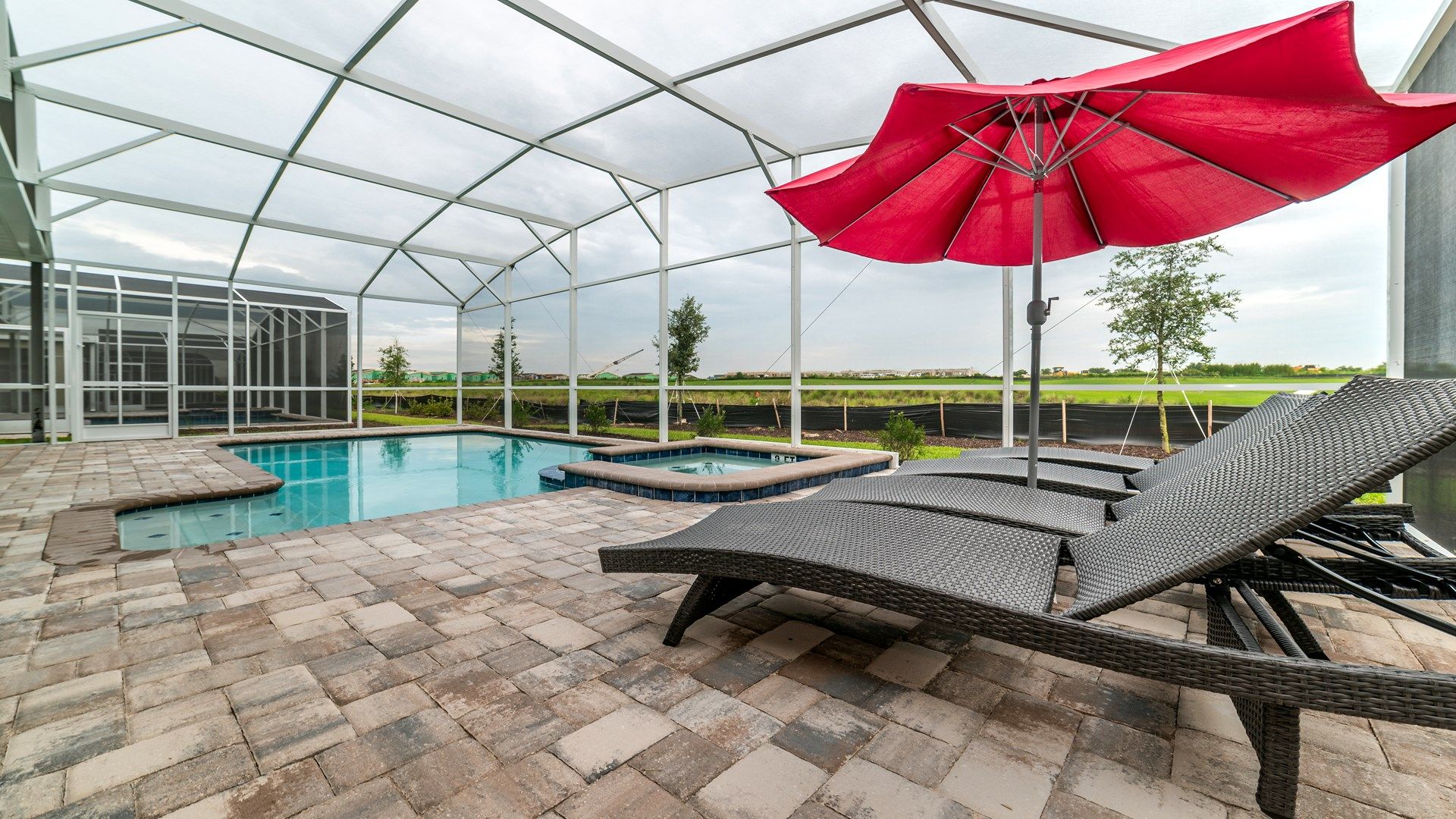 Private pool and spa with loungers and umbrella for ultimate relaxation