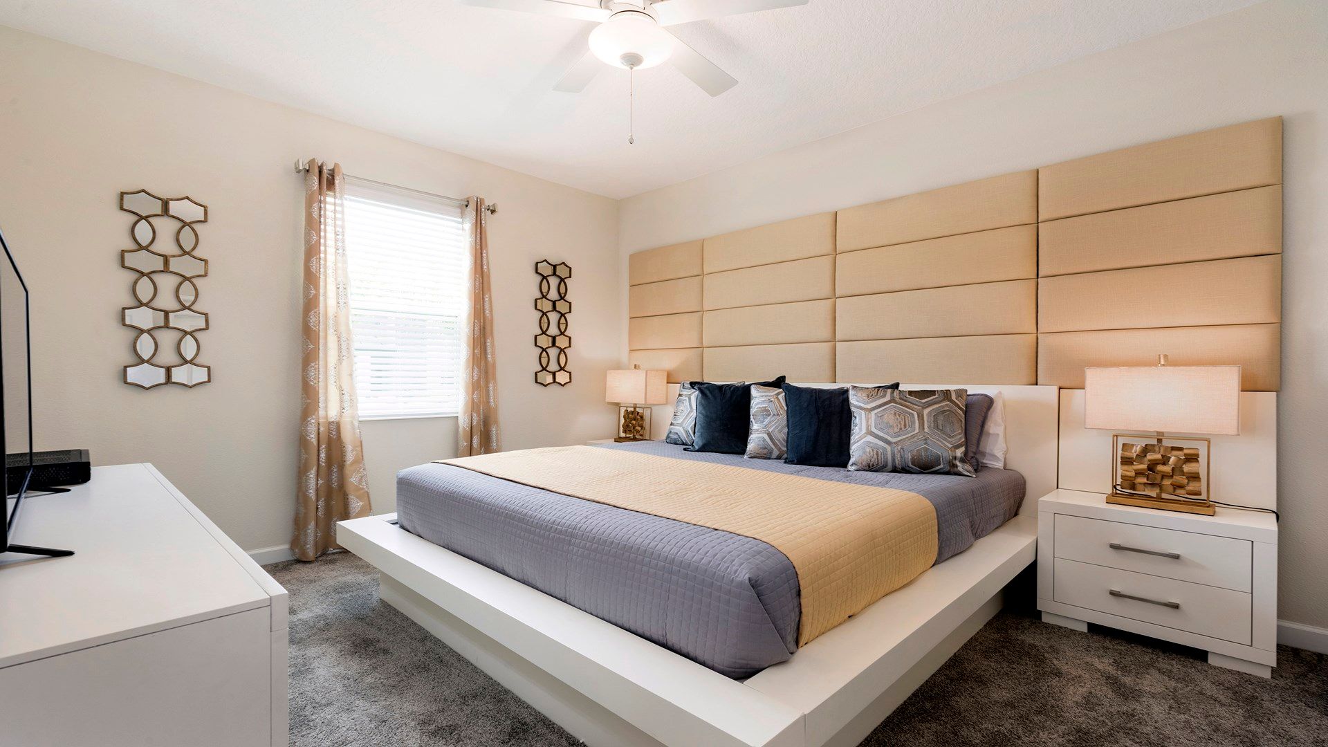 Cozy bedroom with a modern design, soft lighting, and luxurious bedding