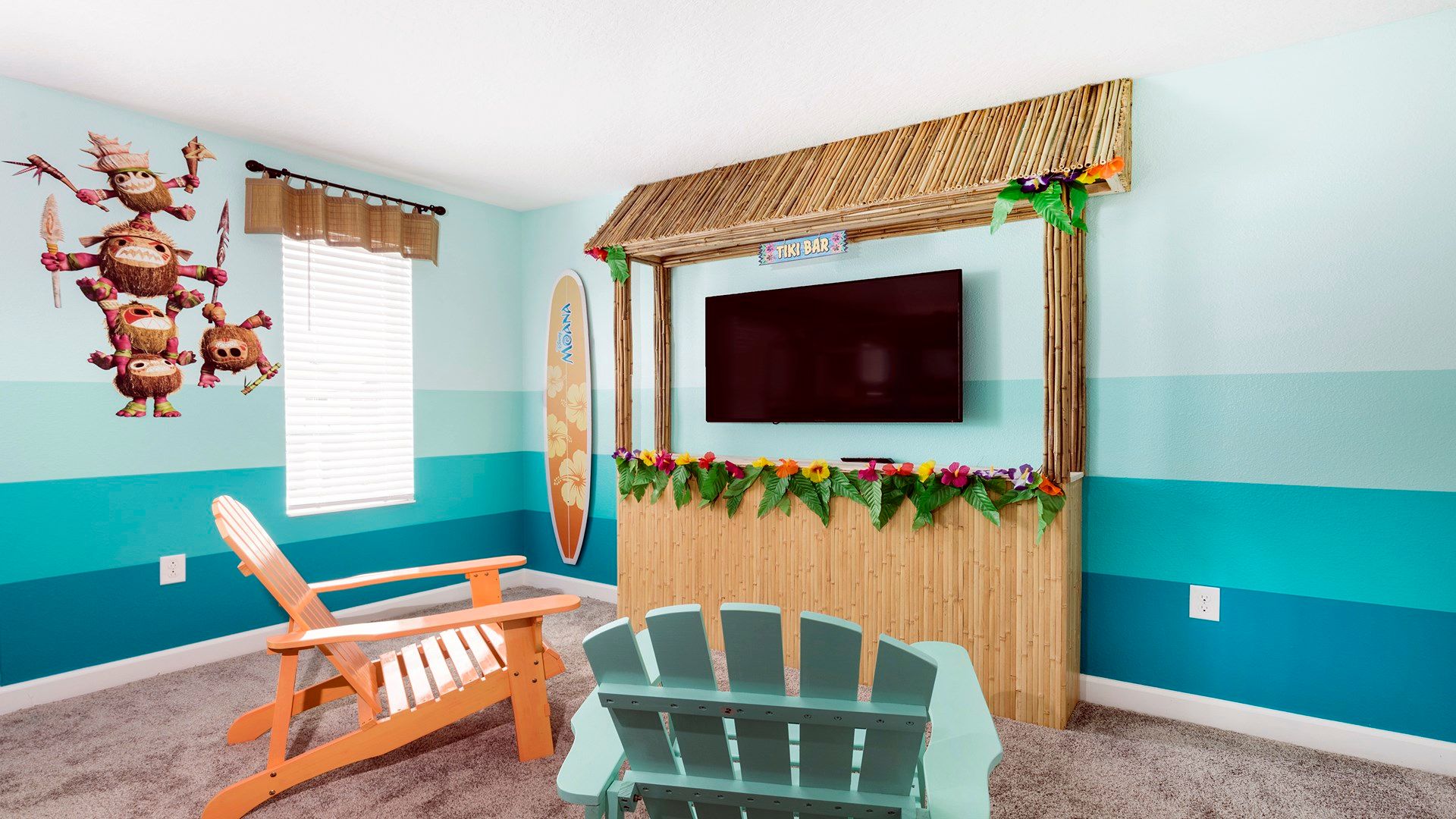 Tropical Moana-themed room with tiki bar, TV, and cozy seating.