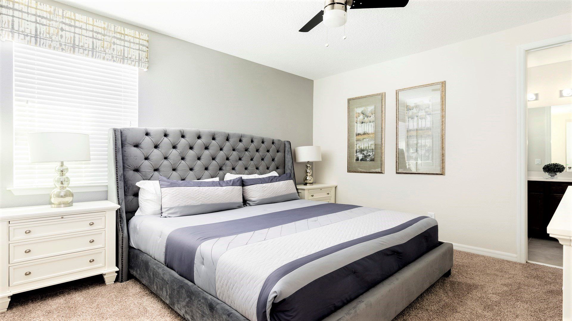 Indulge in royal comfort in the king bedroom, where a luxurious bed takes center stage, complemented by the convenience of a strategically placed TV